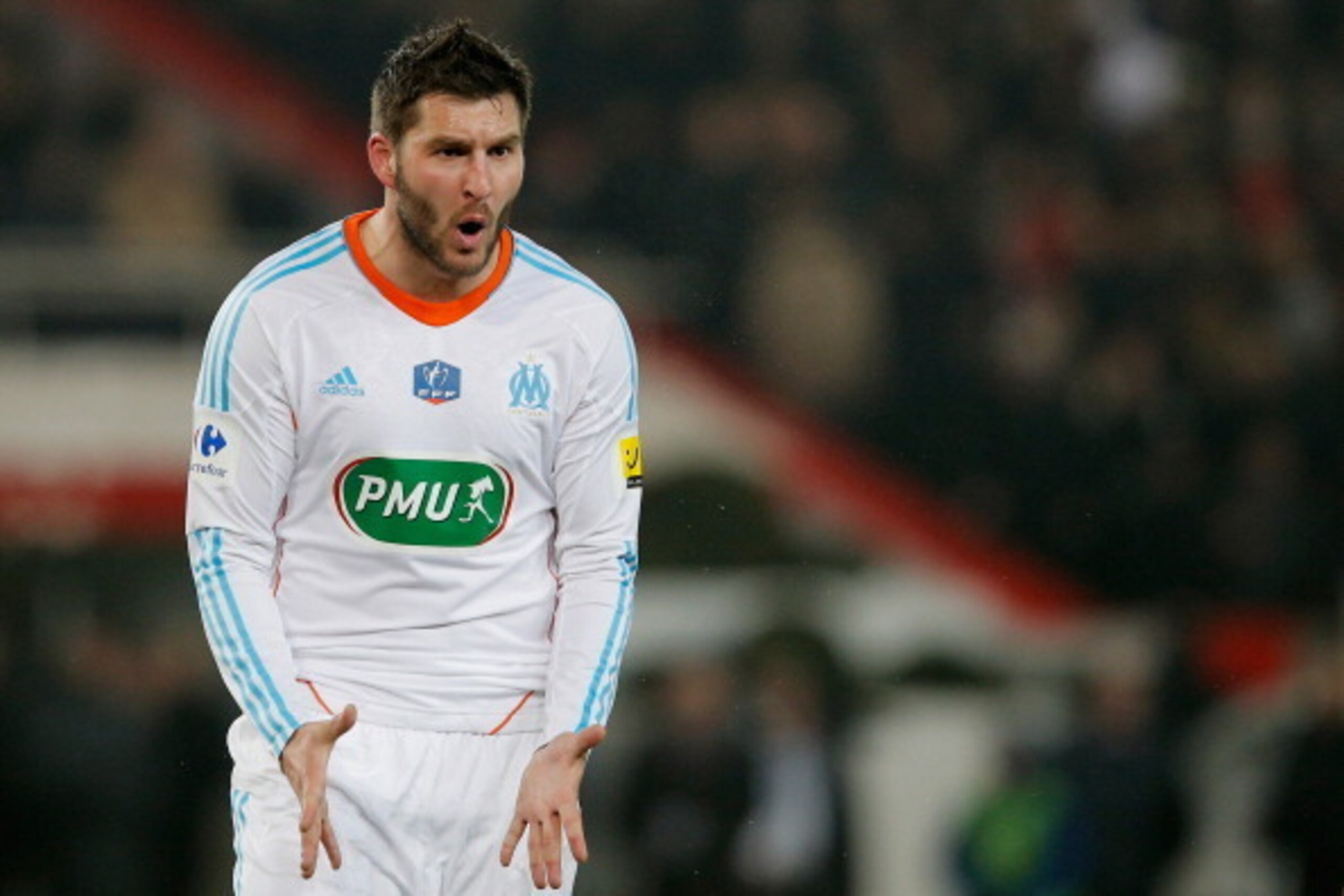 PARIS, FRANCE - FEBRUARY 27:  Andre Pierre Gignac of Marseille reacts to referee Stephane Lannoy after he gives a penalty to PSG during the French Cup match between Paris Saint-Germain FC and Marseille Olympic OM at Parc des Princes on February 27, 2013 i