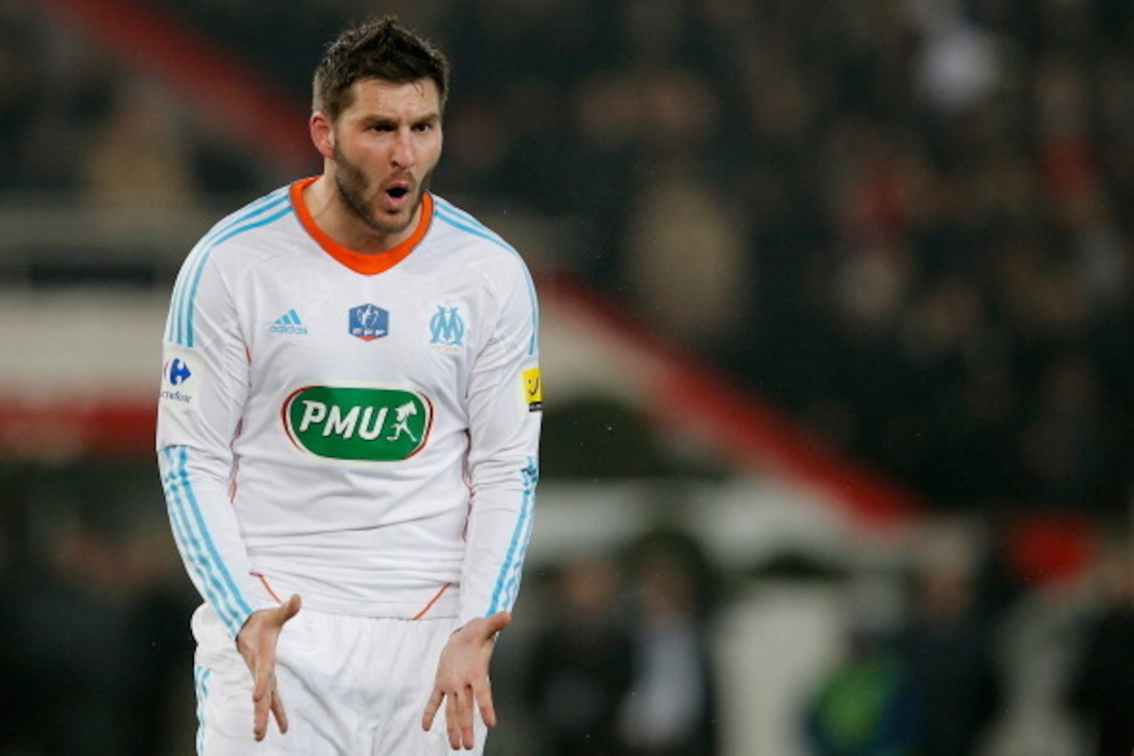 PARIS, FRANCE - FEBRUARY 27:  Andre Pierre Gignac of Marseille reacts to referee Stephane Lannoy after he gives a penalty to PSG during the French Cup match between Paris Saint-Germain FC and Marseille Olympic OM at Parc des Princes on February 27, 2013 i