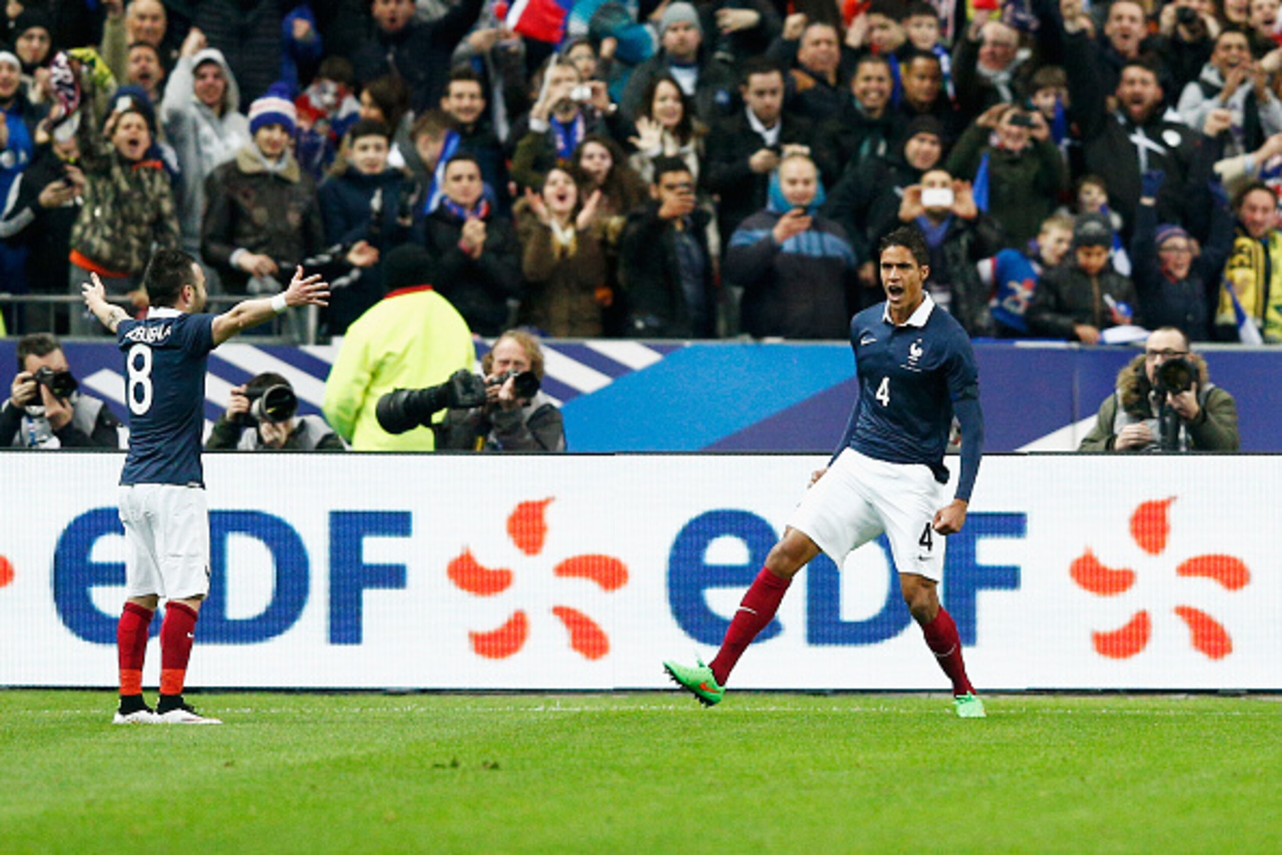 PARIS, FRANCE - MARCH 26:  Raphael Varane #4 of France celebrates with team mates after scoring the first goal of the game during the International Friendly match between France and Brazil at the Stade de France on March 26, 2015 in Paris, France.  (Photo