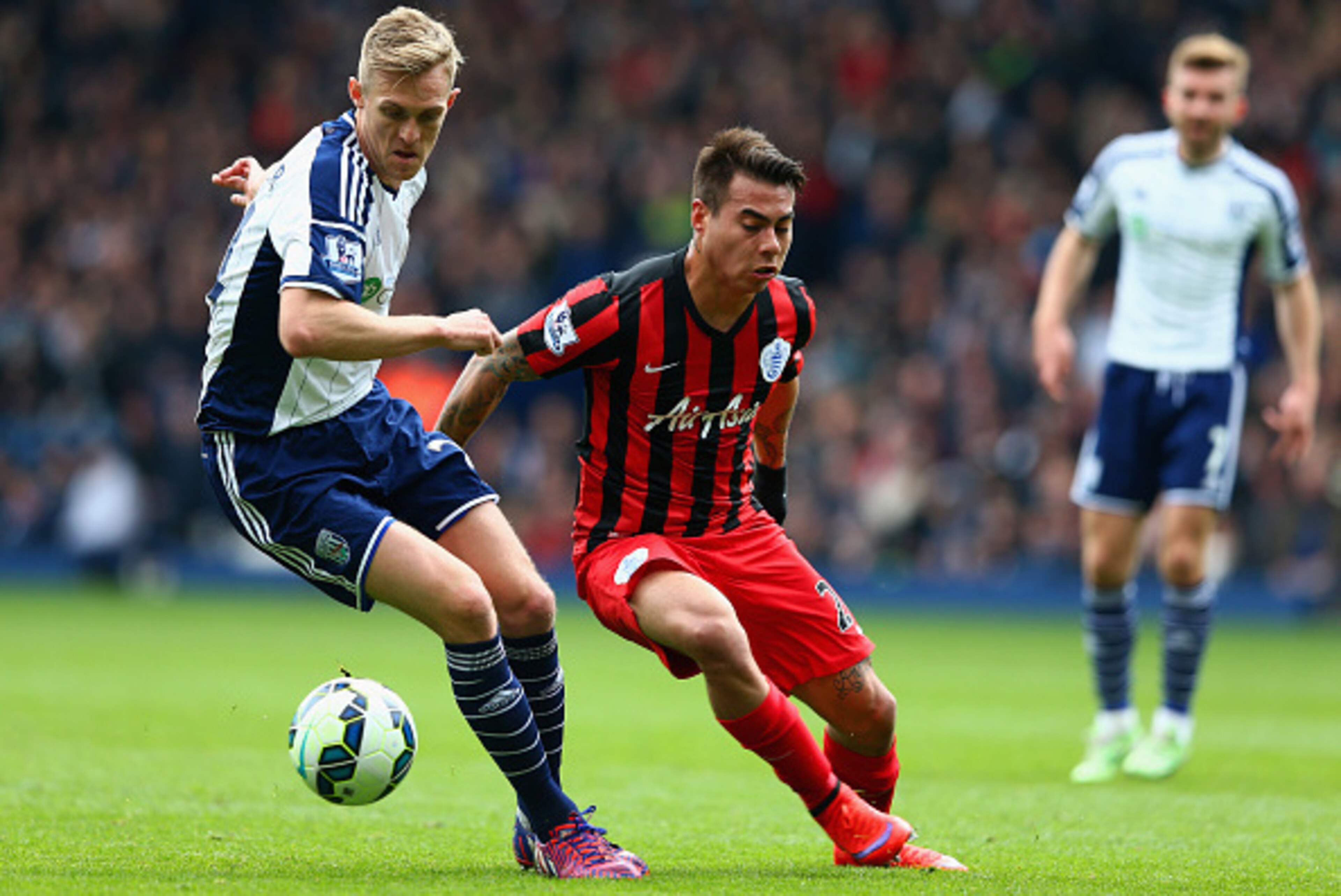 WEST BROMWICH, ENGLAND - APRIL 04:  Darren Fletcher of West Brom and Eduardo Vargas of QPR compete for the ball during the Barclays Premier league match West Bromwich Albion and Queens Park Rangers at The Hawthorns on April 4, 2015 in West Bromwich, Engla