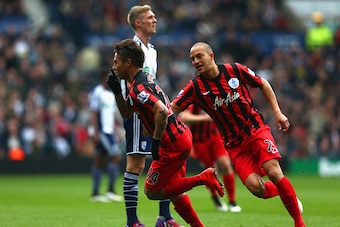 WEST BROMWICH, ENGLAND - APRIL 04:  Eduardo Vargas of QPR celebrates scoring the opening goal with Bobby Zamora of QPR during the Barclays Premier league match West Bromwich Albion and Queens Park Rangers at The Hawthorns on April 4, 2015 in West Bromwich