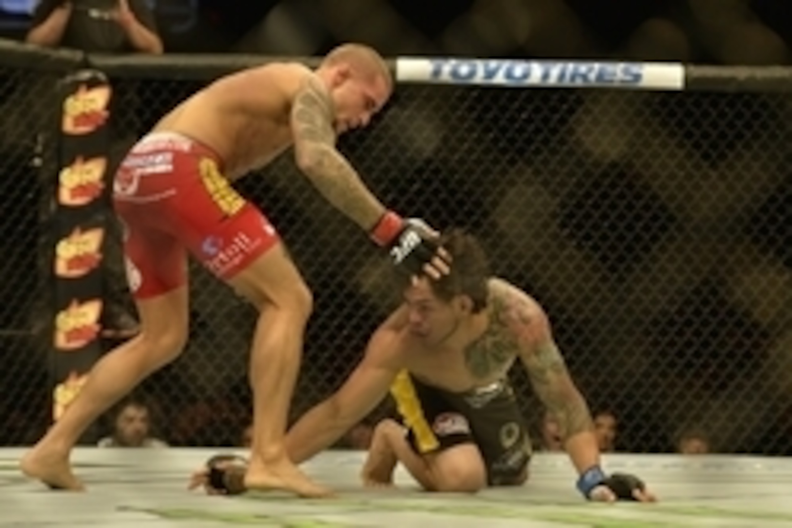Apr 4, 2015; Fairfax, VA, USA; Dustin Poirier (red gloves) fights Diego Ferreira (blue gloves) during UFC Fight Night at Patriot Center. Mandatory Credit: Tommy Gilligan-USA TODAY Sports