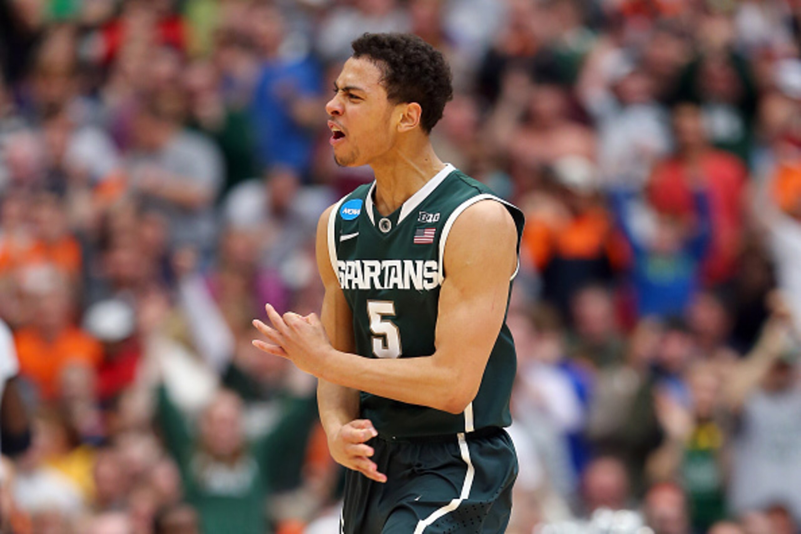 SYRACUSE, NY - MARCH 29:  Bryn Forbes #5 of the Michigan State Spartans reacts to a three pointer in the second half of the game against the Louisville Cardinals during the East Regional Final of the 2015 NCAA Men's Basketball Tournament at Carrier Dome o