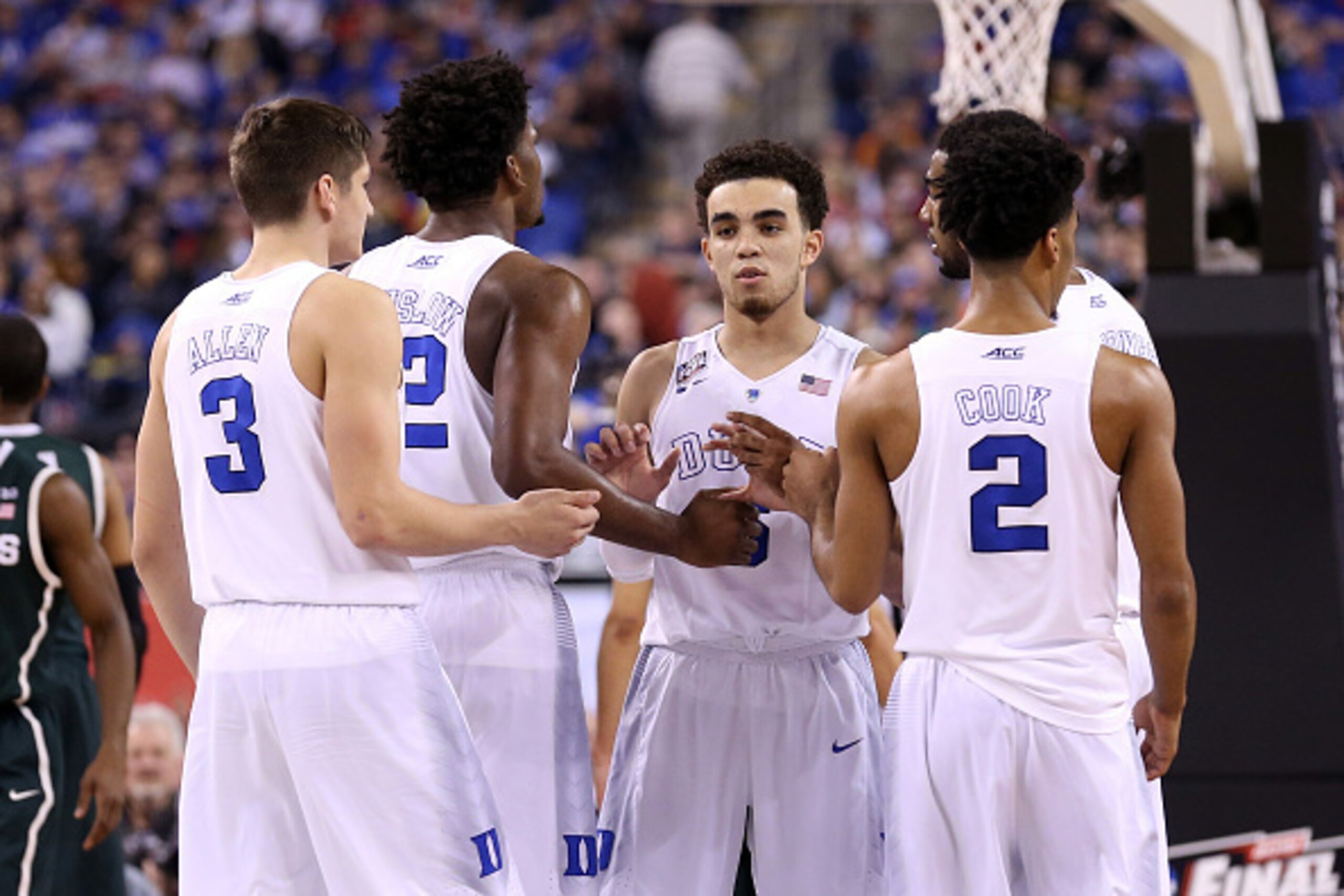 INDIANAPOLIS, IN - APRIL 04: Tyus Jones #5 of the Duke Blue Devils celebrates with teammates Grayson Allen #3, Justise Winslow #12 and Quinn Cook #2 late in the game against the Michigan State Spartans during the NCAA Men's Final Four Semifinal at Lucas O