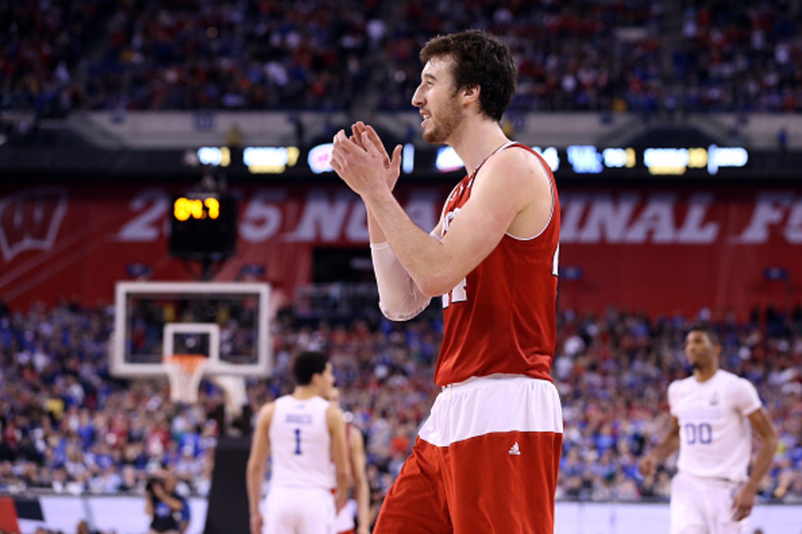 INDIANAPOLIS, IN - APRIL 04:  Frank Kaminsky #44 of the Wisconsin Badgers celebrates late in the game against the Kentucky Wildcats during the NCAA Men's Final Four Semifinal at Lucas Oil Stadium on April 4, 2015 in Indianapolis, Indiana.  (Photo by Stree