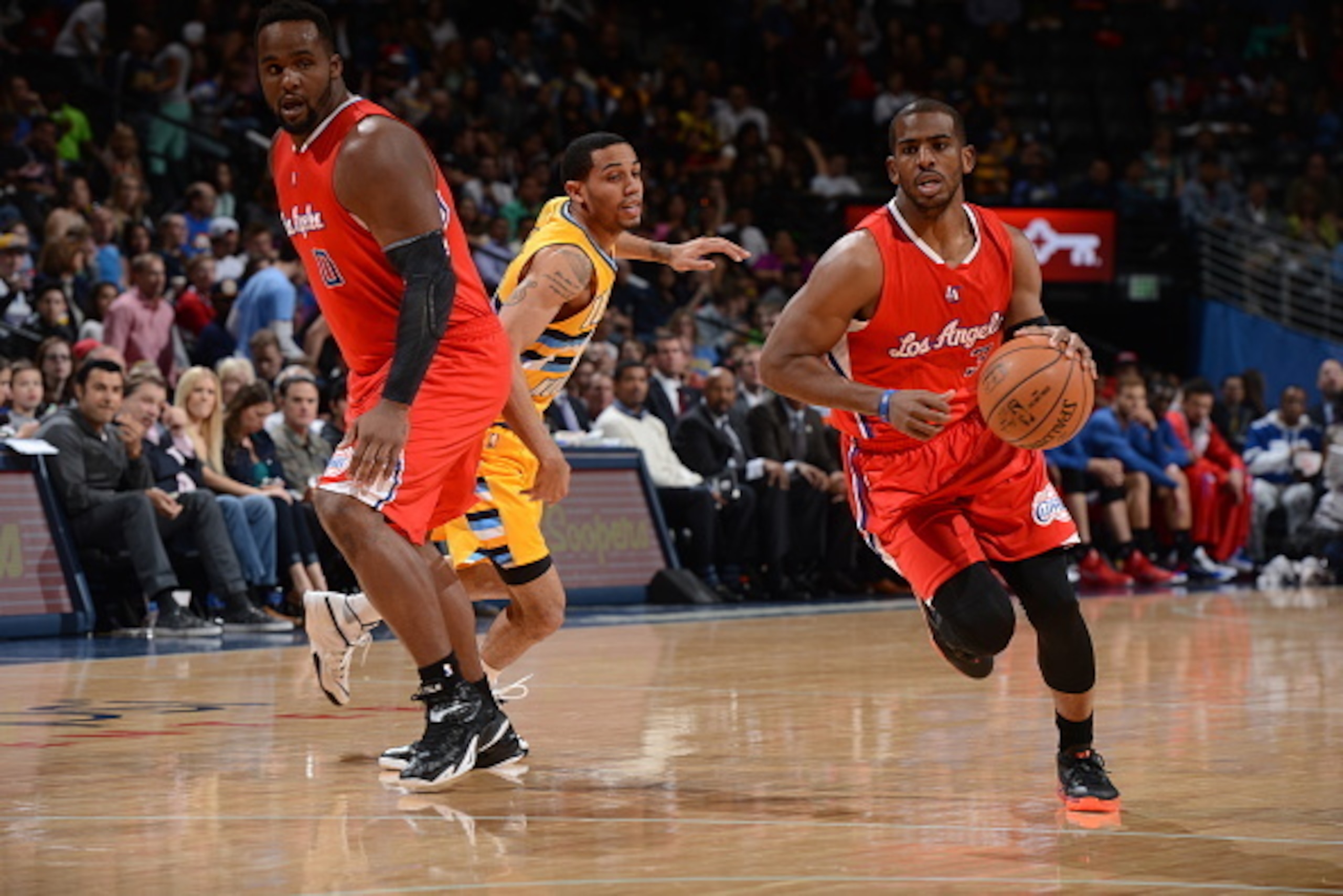 DENVER, CO - APRIL 4:  Chris Paul #3 of the Los Angeles Clippers brings the ball up court against the Denver Nuggets on April 4, 2015 at the Pepsi Center in Denver, Colorado. NOTE TO USER: User expressly acknowledges and agrees that, by downloading and or
