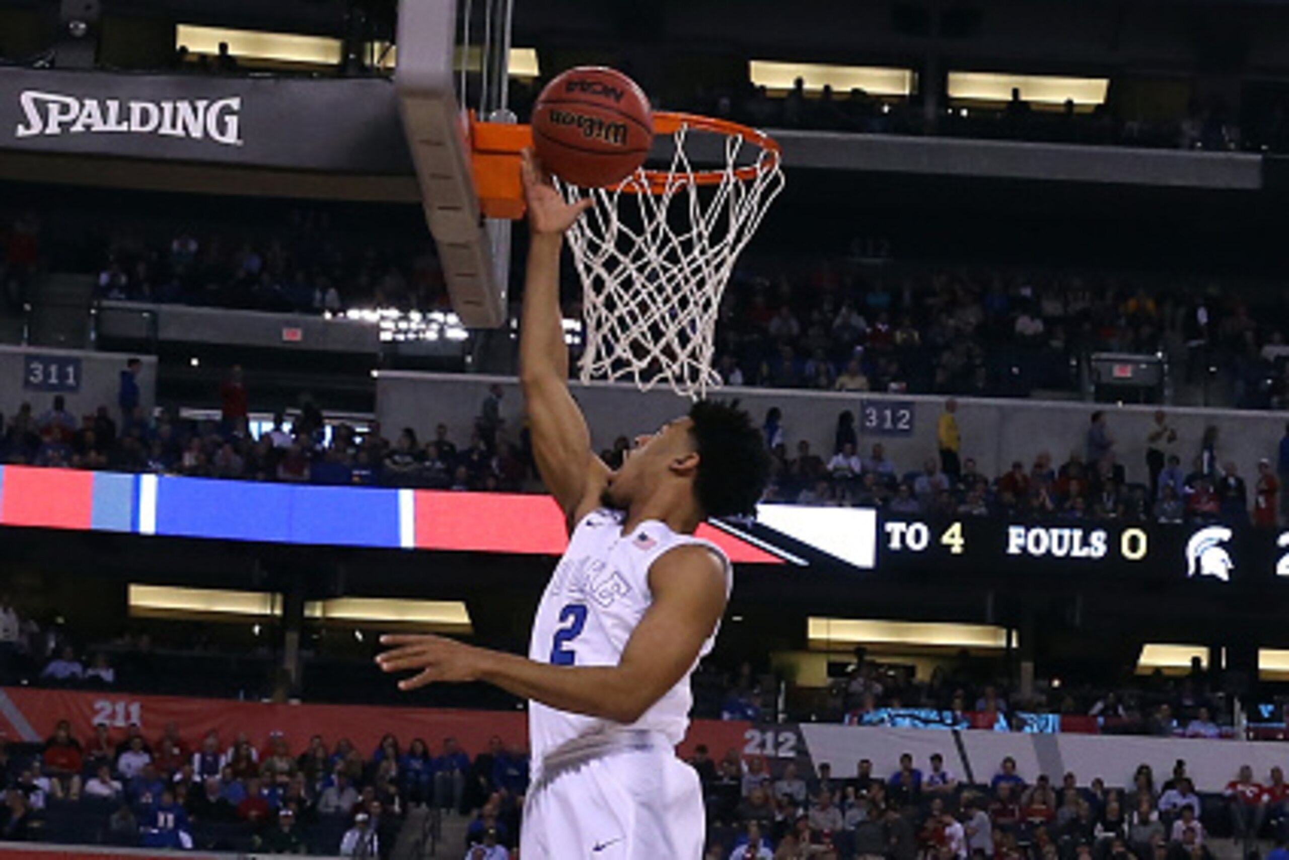 INDIANAPOLIS, IN - APRIL 04: Quinn Cook #2 of the Duke Blue Devils drives to the basket in the second half against the Michigan State Spartans during the NCAA Men's Final Four Semifinal at Lucas Oil Stadium on April 4, 2015 in Indianapolis, Indiana.  (Pho