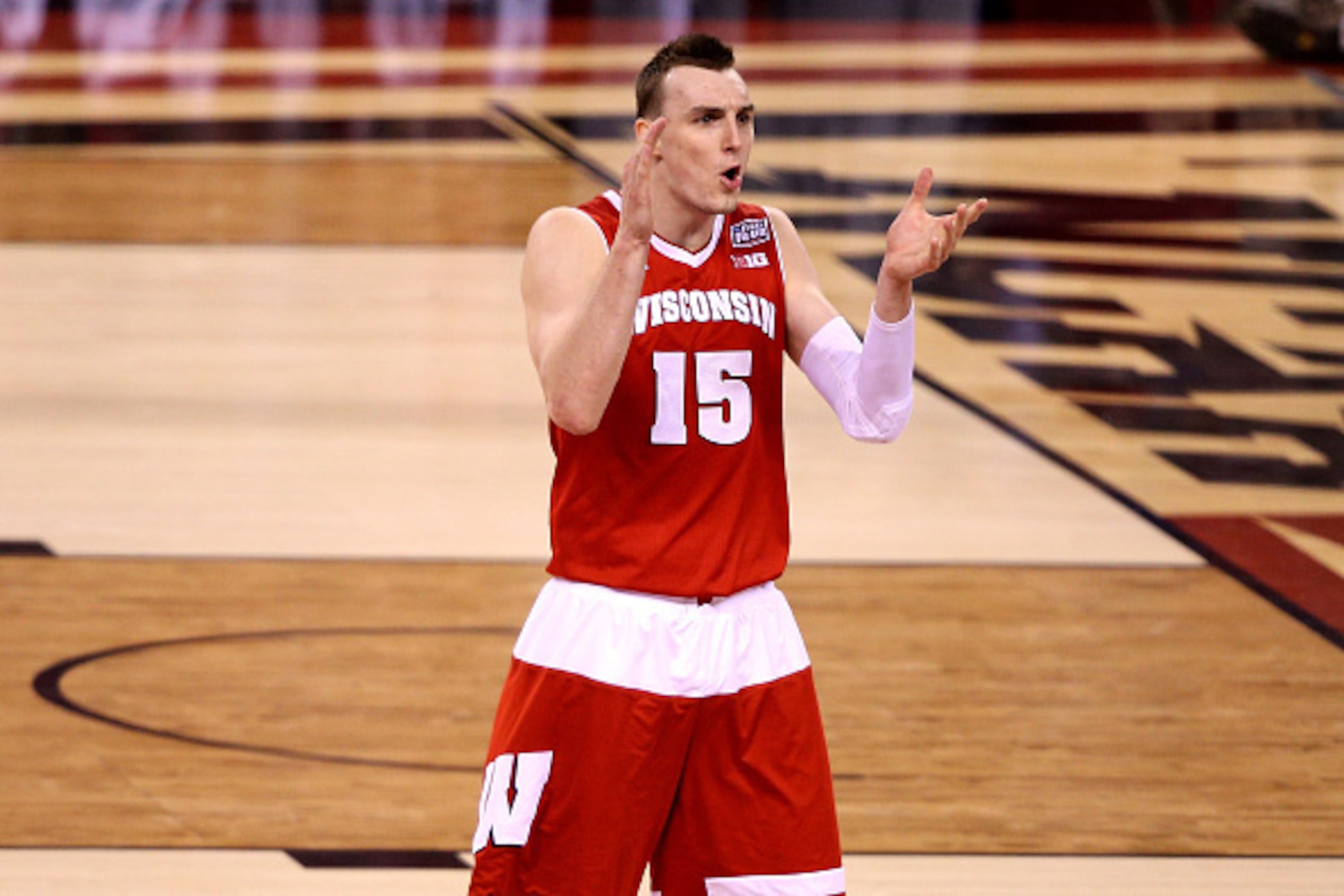INDIANAPOLIS, IN - APRIL 04:  Sam Dekker #15 of the Wisconsin Badgers reacts in the second half against the Kentucky Wildcats during the NCAA Men's Final Four Semifinal at Lucas Oil Stadium on April 4, 2015 in Indianapolis, Indiana.  (Photo by Joe Robbins