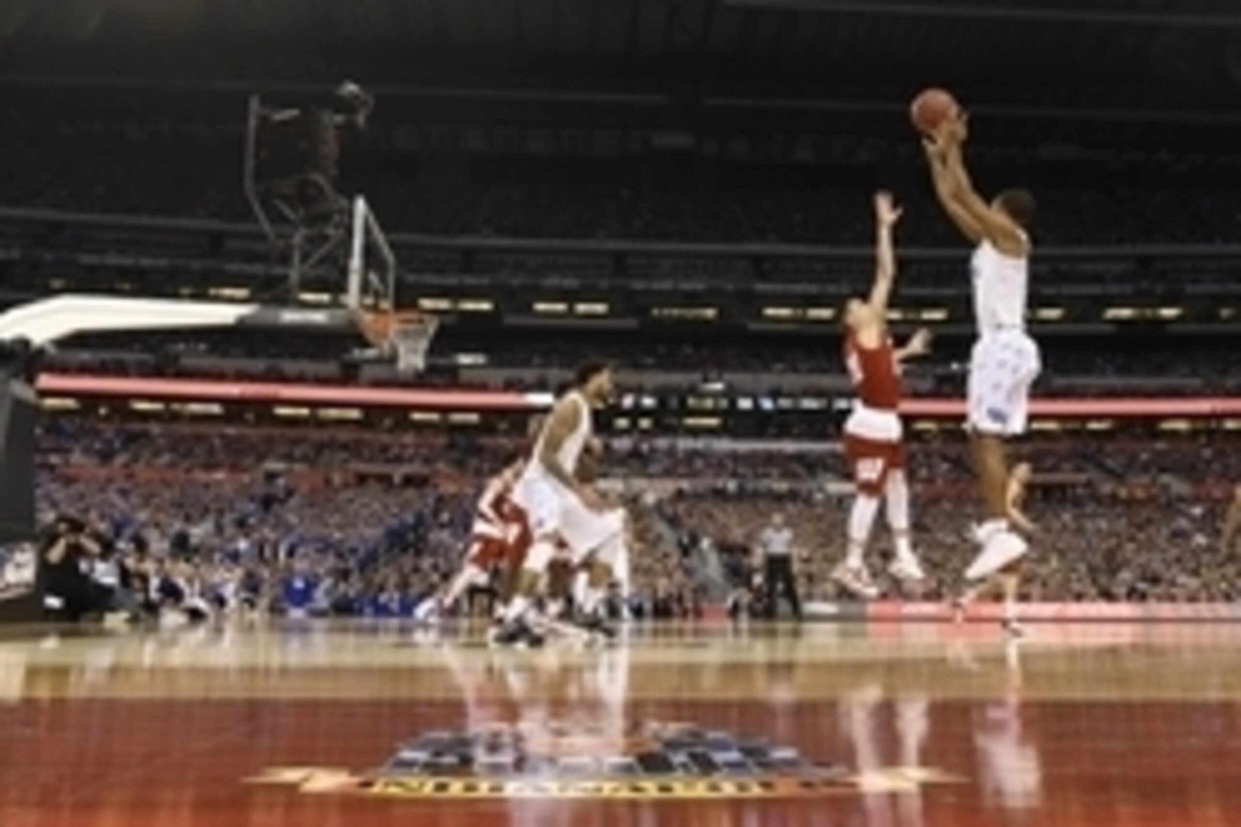 Apr 4, 2015; Indianapolis, IN, USA; Kentucky Wildcats guard Aaron Harrison (2) shoots a three-point shot over Wisconsin Badgers guard Josh Gasser (21) in the second half of the 2015 NCAA Men's Division I Championship semi-final game at Lucas Oil Stadium. Apr 4, 2015; Indianapolis, IN, USA; Kentucky Wildcats guard Aaron Harrison (2) shoots a three-point shot over Wisconsin Badgers guard Josh Gasser (21) in the second half of the 2015 NCAA Men's Division I Championship semi-final game at Lucas Oil Stadium.