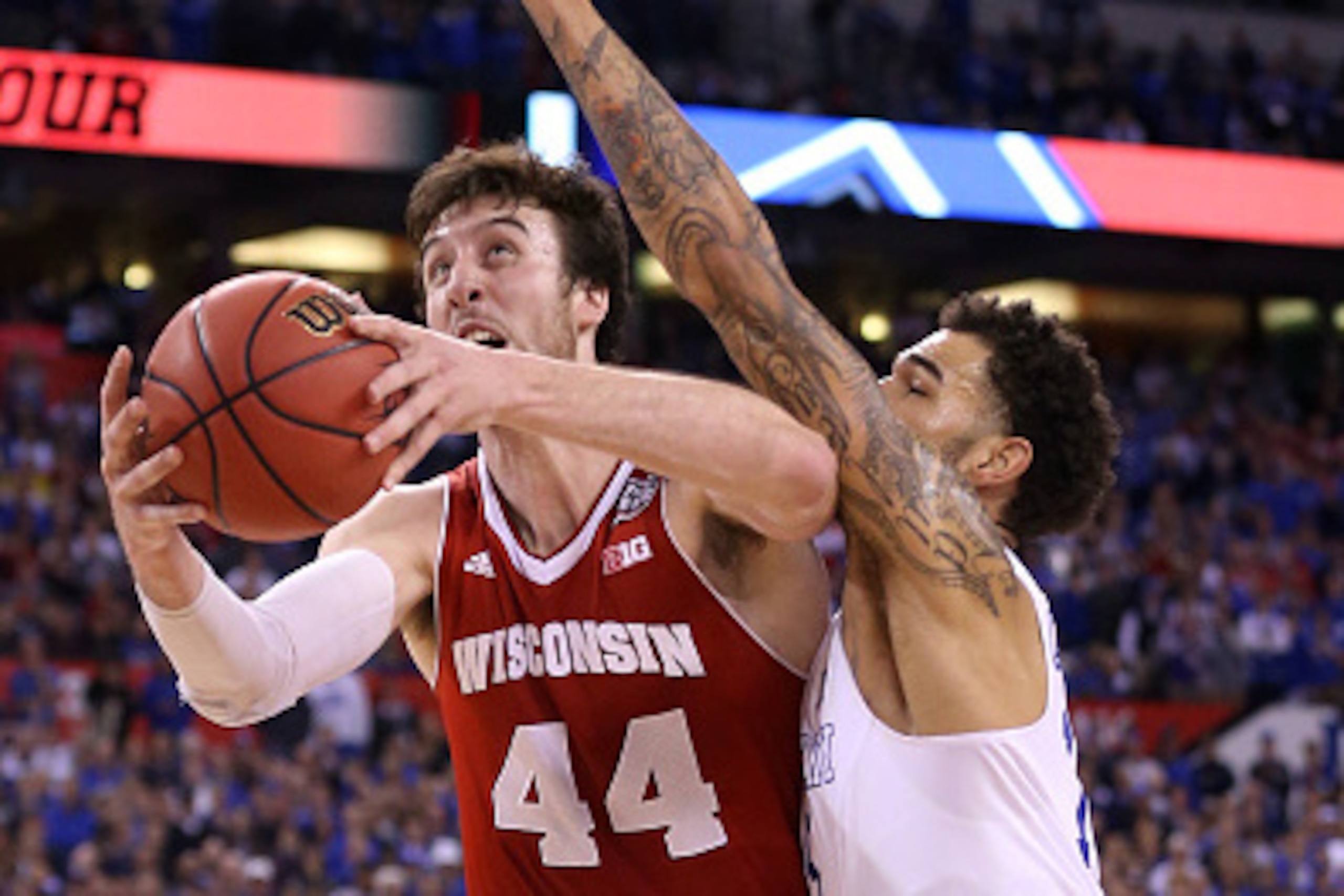 INDIANAPOLIS, IN - APRIL 04: Frank Kaminsky #44 of the Wisconsin Badgers handles the ball against Willie Cauley-Stein #15 of the Kentucky Wildcats in the second half during the NCAA Men's Final Four Semifinal at Lucas Oil Stadium on April 4, 2015 in India INDIANAPOLIS, IN - APRIL 04: Frank Kaminsky #44 of the Wisconsin Badgers handles the ball against Willie Cauley-Stein #15 of the Kentucky Wildcats in the second half during the NCAA Men's Final Four Semifinal at Lucas Oil Stadium on April 4, 2015 in India