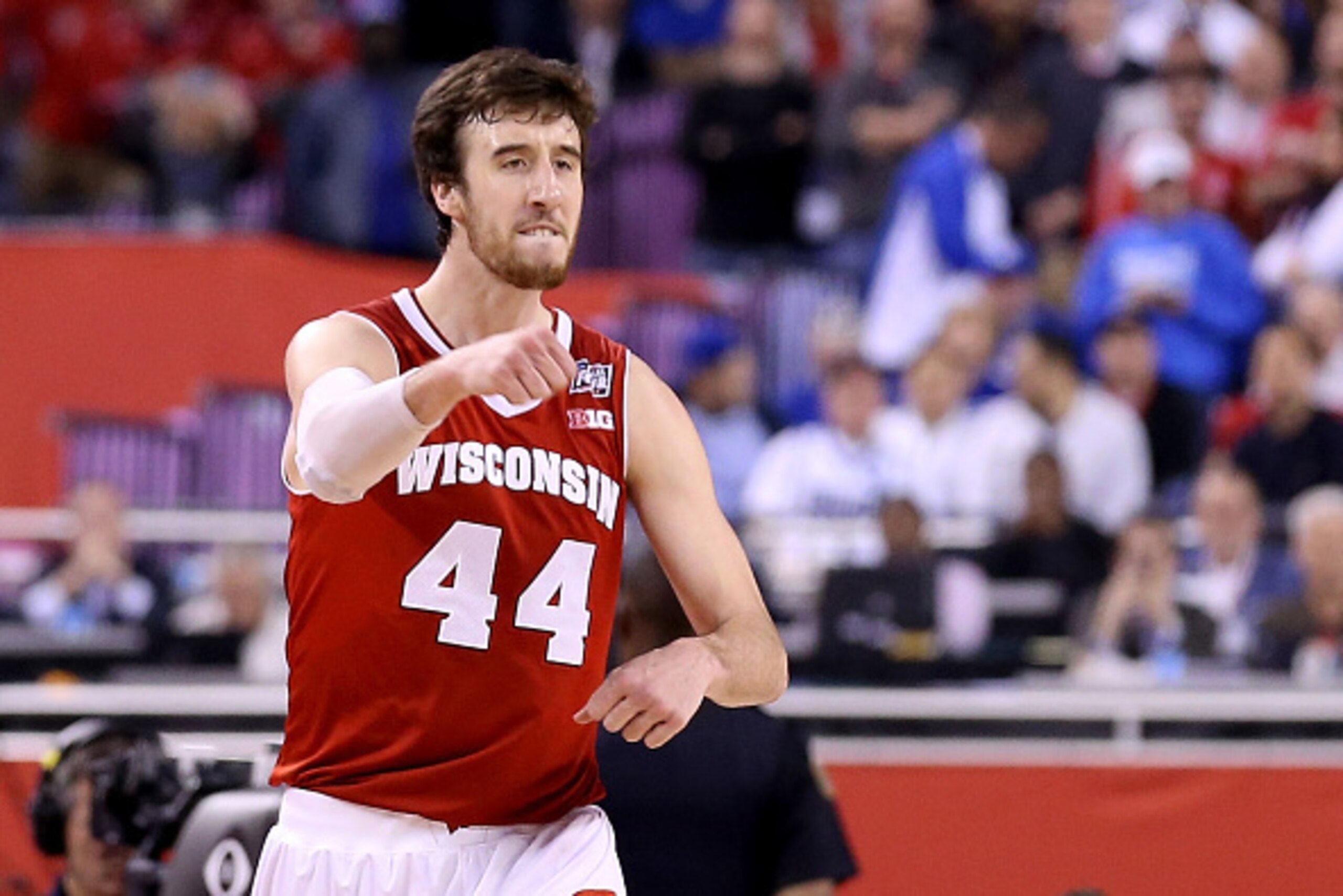 INDIANAPOLIS, IN - APRIL 04:  Frank Kaminsky #44 of the Wisconsin Badgers celebrates late in the game against the Kentucky Wildcats during the NCAA Men's Final Four Semifinal at Lucas Oil Stadium on April 4, 2015 in Indianapolis, Indiana.  (Photo by Stree