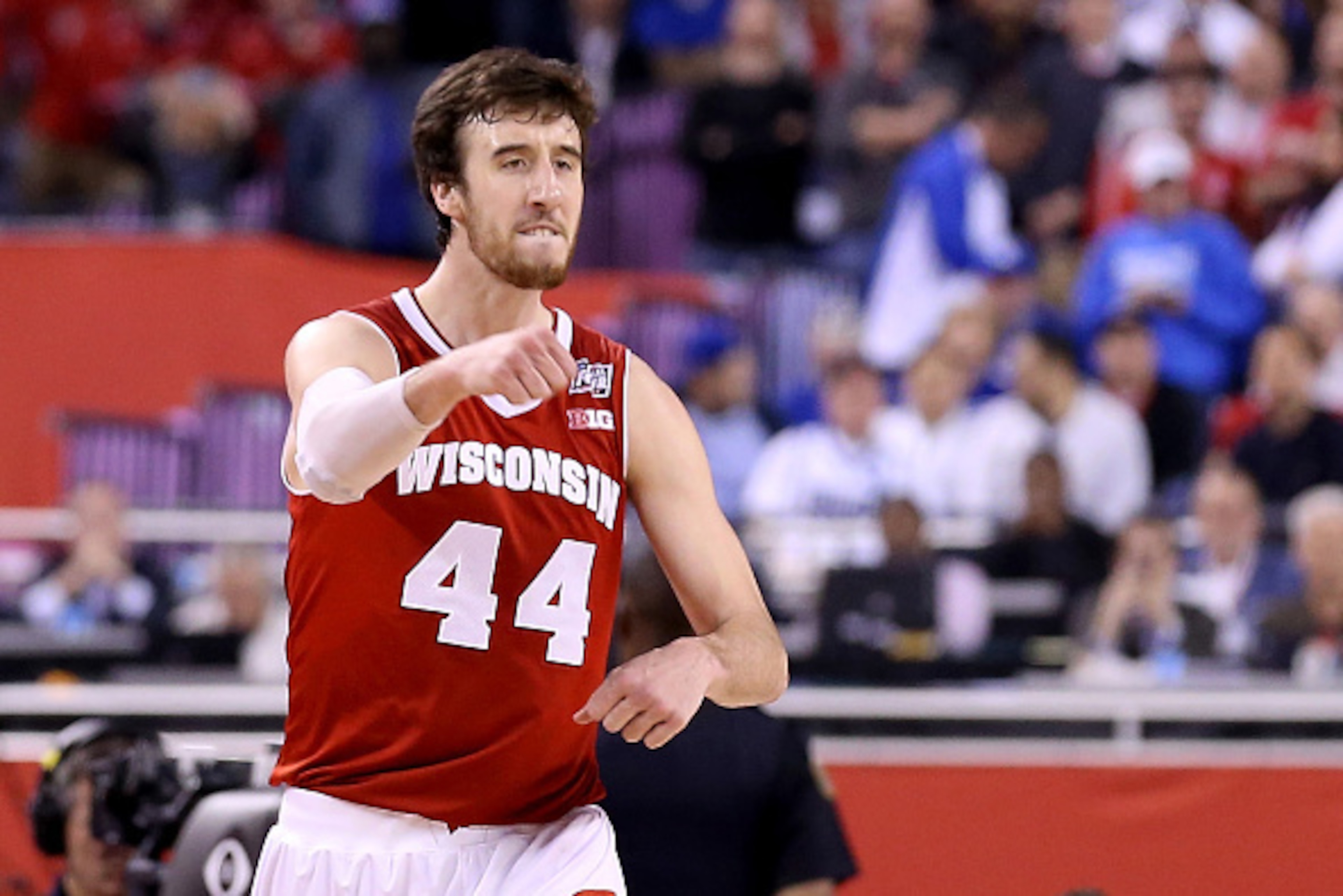 INDIANAPOLIS, IN - APRIL 04:  Frank Kaminsky #44 of the Wisconsin Badgers celebrates late in the game against the Kentucky Wildcats during the NCAA Men's Final Four Semifinal at Lucas Oil Stadium on April 4, 2015 in Indianapolis, Indiana.  (Photo by Stree