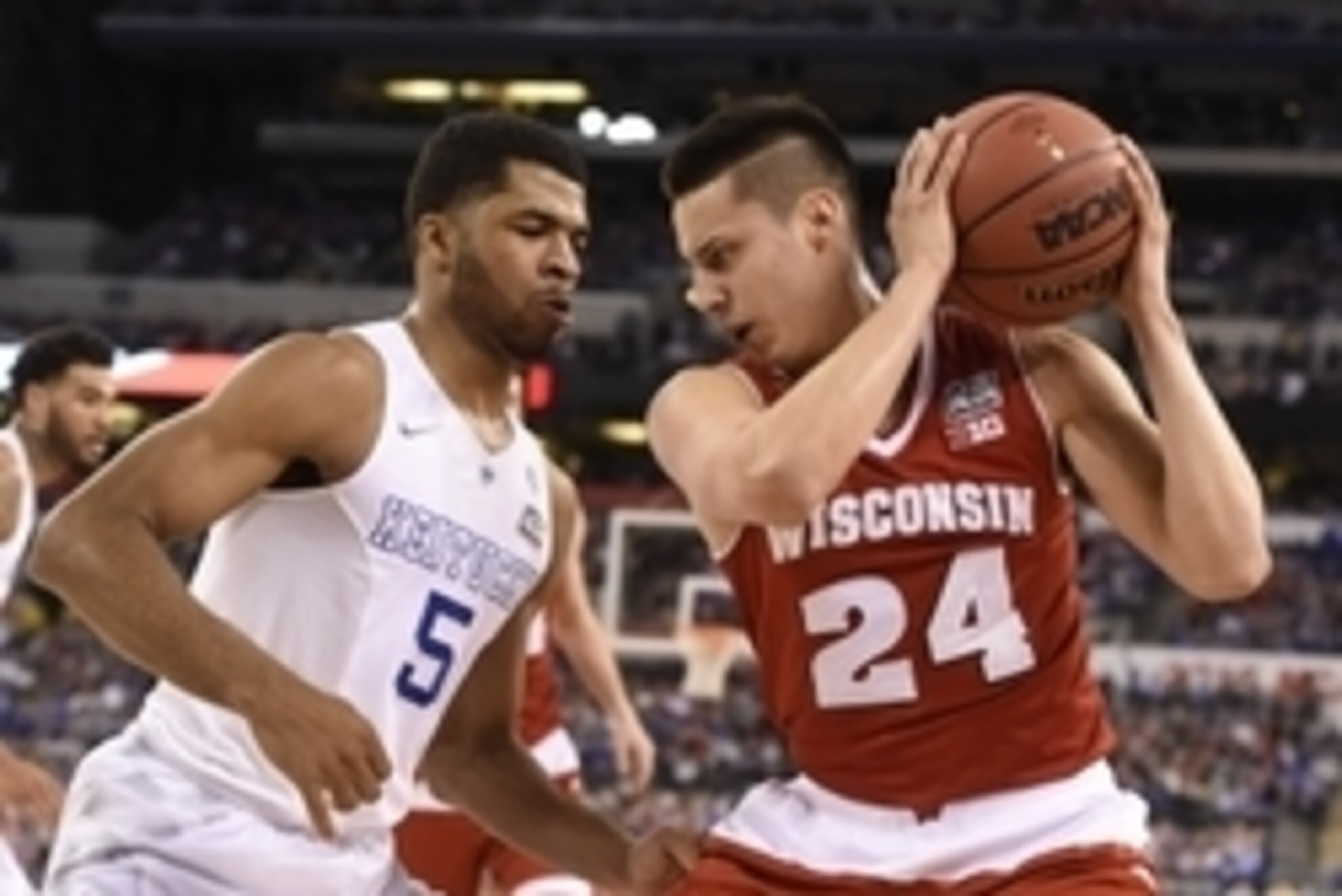 Apr 4, 2015; Indianapolis, IN, USA; Wisconsin Badgers guard Bronson Koenig (24) is defended by Kentucky Wildcats guard Andrew Harrison (5) in the first half of the 2015 NCAA Men's Division I Championship semi-final game at Lucas Oil Stadium. Mandatory Cre Apr 4, 2015; Indianapolis, IN, USA; Wisconsin Badgers guard Bronson Koenig (24) is defended by Kentucky Wildcats guard Andrew Harrison (5) in the first half of the 2015 NCAA Men's Division I Championship semi-final game at Lucas Oil Stadium. Mandatory Cre
