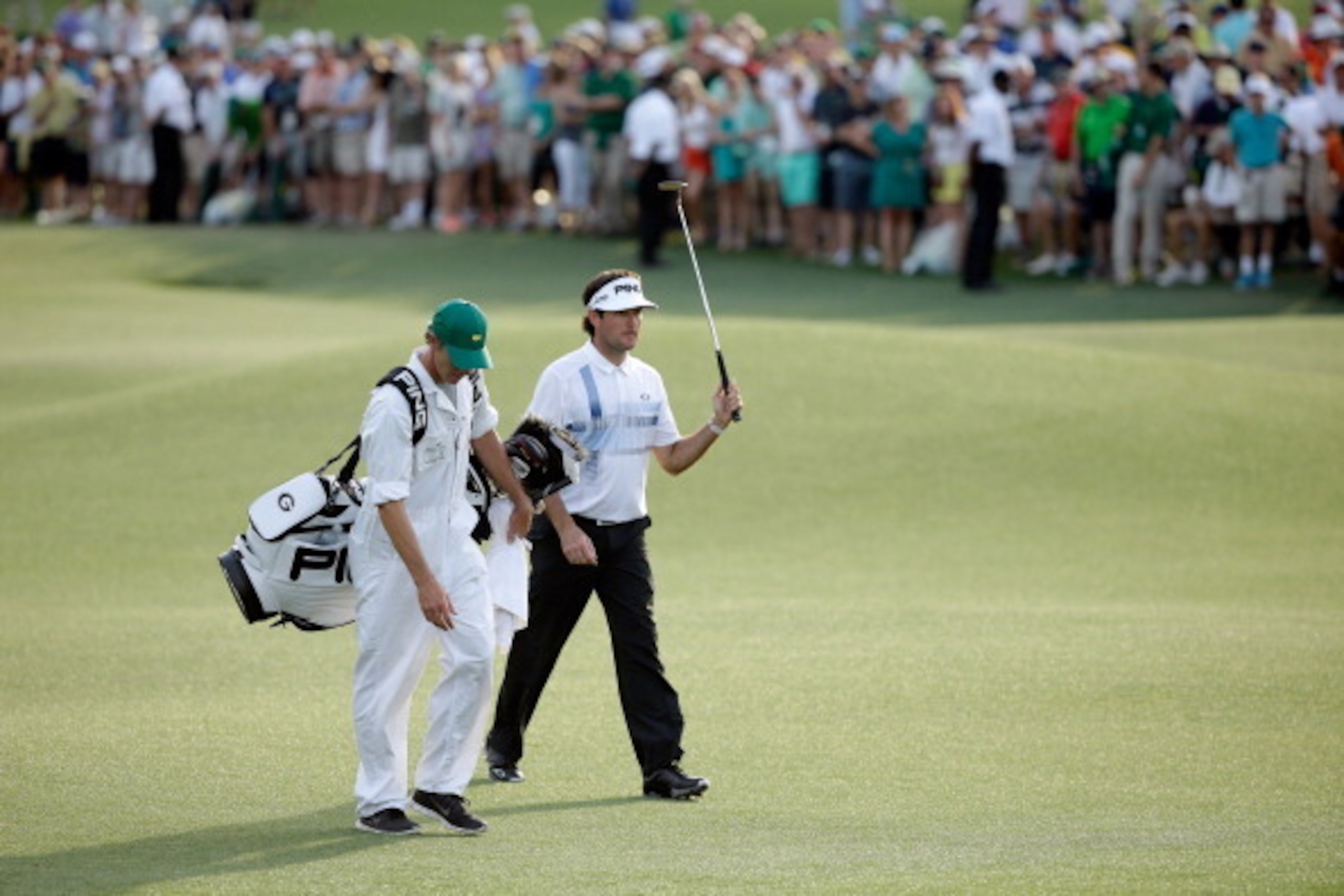 AUGUSTA, GA - APRIL 13:  Bubba Watson of the United States walks up to the 18th green in route to winning the 2014 Masters Tournament by a three-stroke margin at Augusta National Golf Club on April 13, 2014 in Augusta, Georgia.  (Photo by Ezra Shaw/Getty 