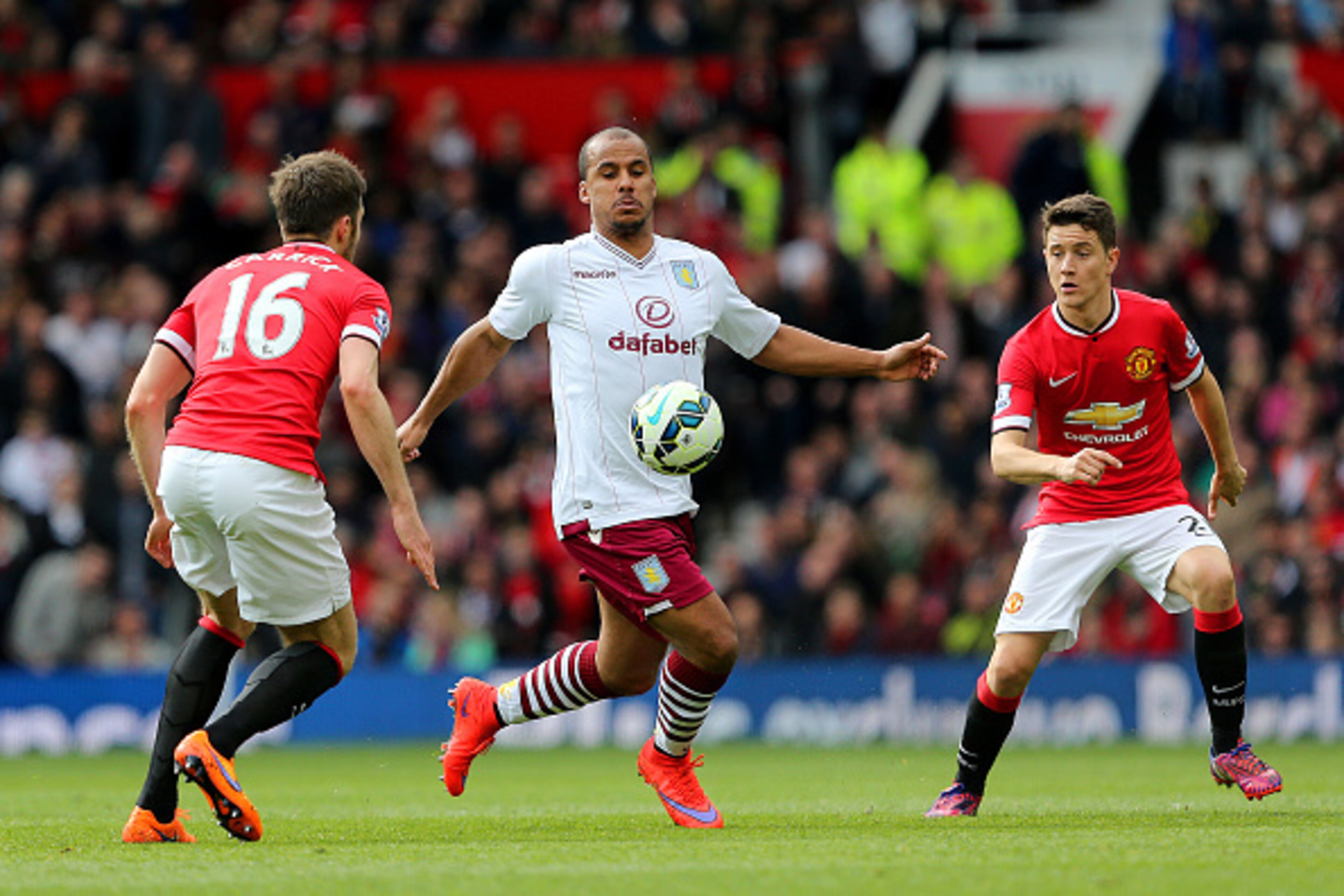 MANCHESTER, ENGLAND - APRIL 04: Gabriel Agbonlahor of Aston Villa battles for the ball with Michael Carrick of Manchester United and Ander Herrera of Manchester United during the Barclays Premier League match between Manchester United and Aston Villa at MANCHESTER, ENGLAND - APRIL 04: Gabriel Agbonlahor of Aston Villa battles for the ball with Michael Carrick of Manchester United and Ander Herrera of Manchester United during the Barclays Premier League match between Manchester United and Aston Villa at