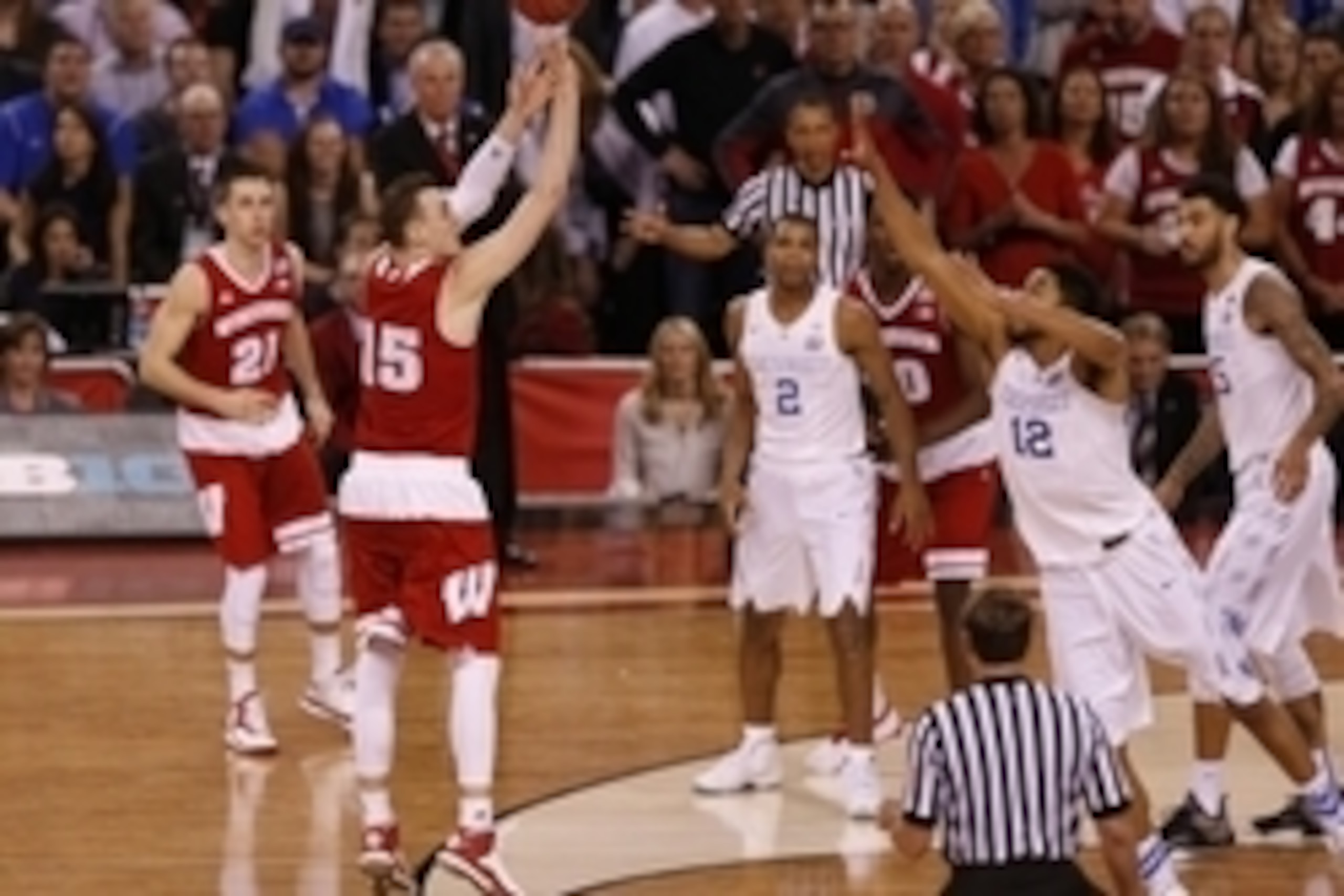 Apr 4, 2015; Indianapolis, IN, USA; Wisconsin Badgers forward Sam Dekker (15) shoots a three-pointer during the second half of the 2015 NCAA Men's Division I Championship semi-final game against the Kentucky Wildcats at Lucas Oil Stadium. Mandatory Credit