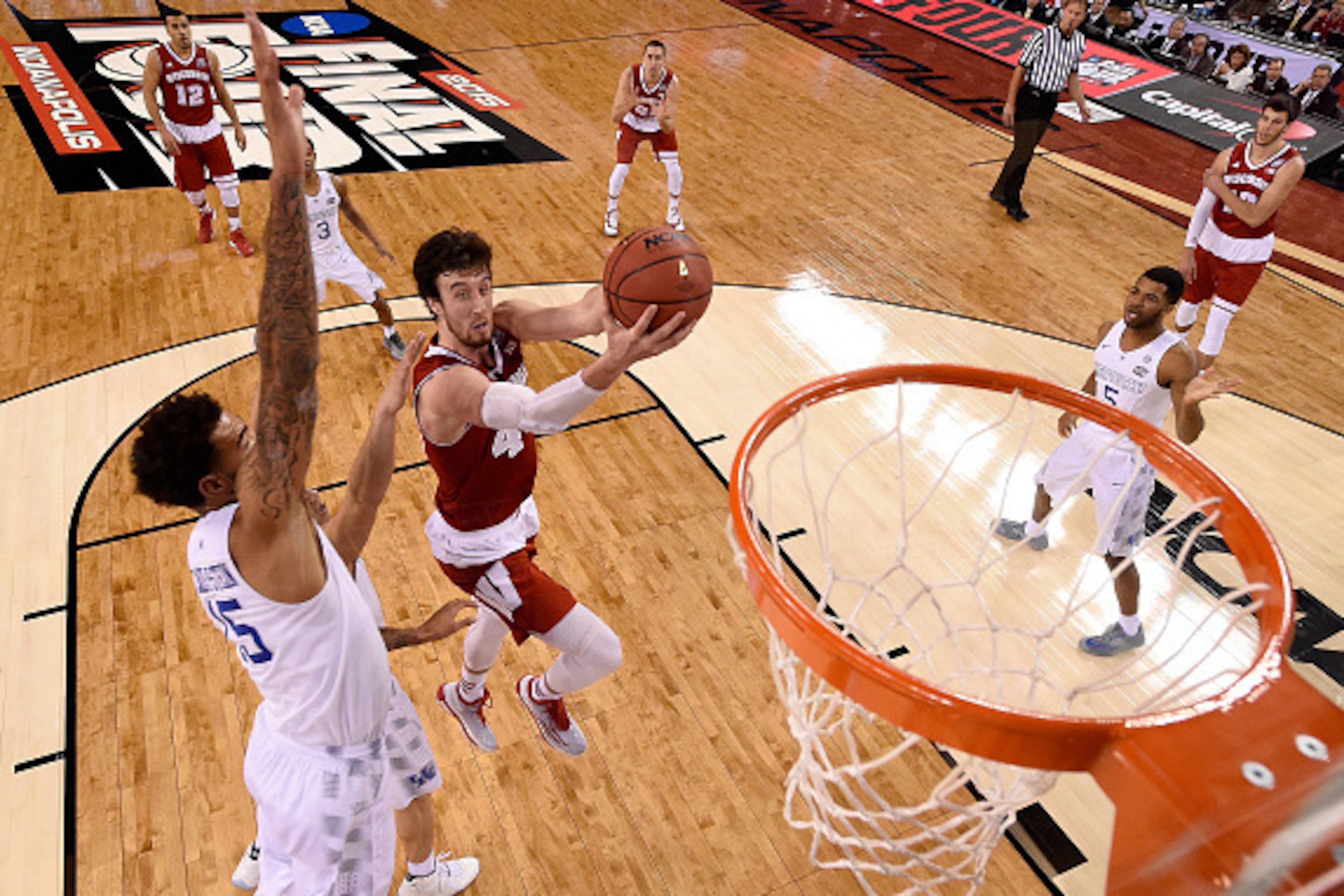 INDIANAPOLIS, IN - APRIL 04: Frank Kaminsky #44 of the Wisconsin Badgers drives to the basket against Willie Cauley-Stein #15 of the Kentucky Wildcats in the second half during the NCAA Men's Final Four Semifinal at Lucas Oil Stadium on April 4, 2015 in I