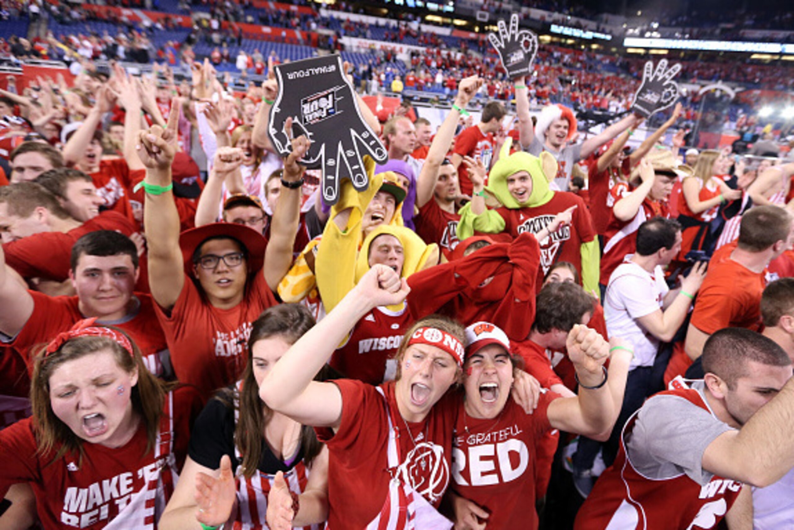 INDIANAPOLIS, IN - APRIL 04: Wisconsin Badgers fans celebrate after defeating the Kentucky Wildcats during the NCAA Men's Final Four Semifinal at Lucas Oil Stadium on April 4, 2015 in Indianapolis, Indiana. Wisconsin defeated Kentucky 71-64. (Photo by Str