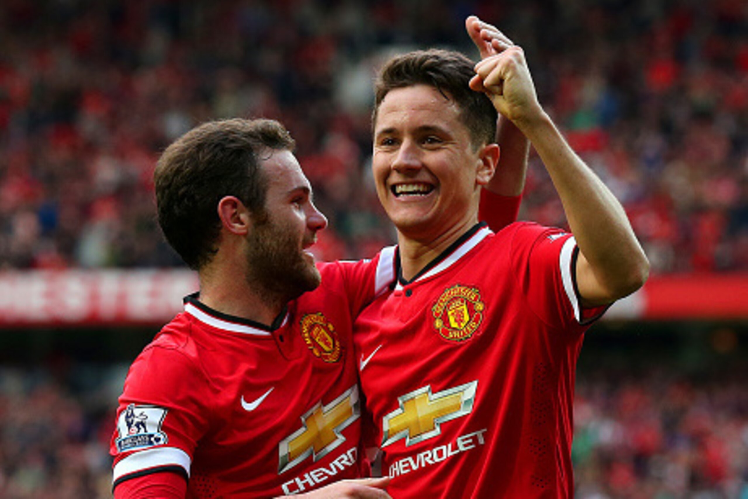 MANCHESTER, ENGLAND - APRIL 04:  Ander Herrera of Manchester United celebrates with team-mate Juan Mata of Manchester United after scoring his team's third goal during the Barclays Premier League match between Manchester United and Aston Villa at Old Traf