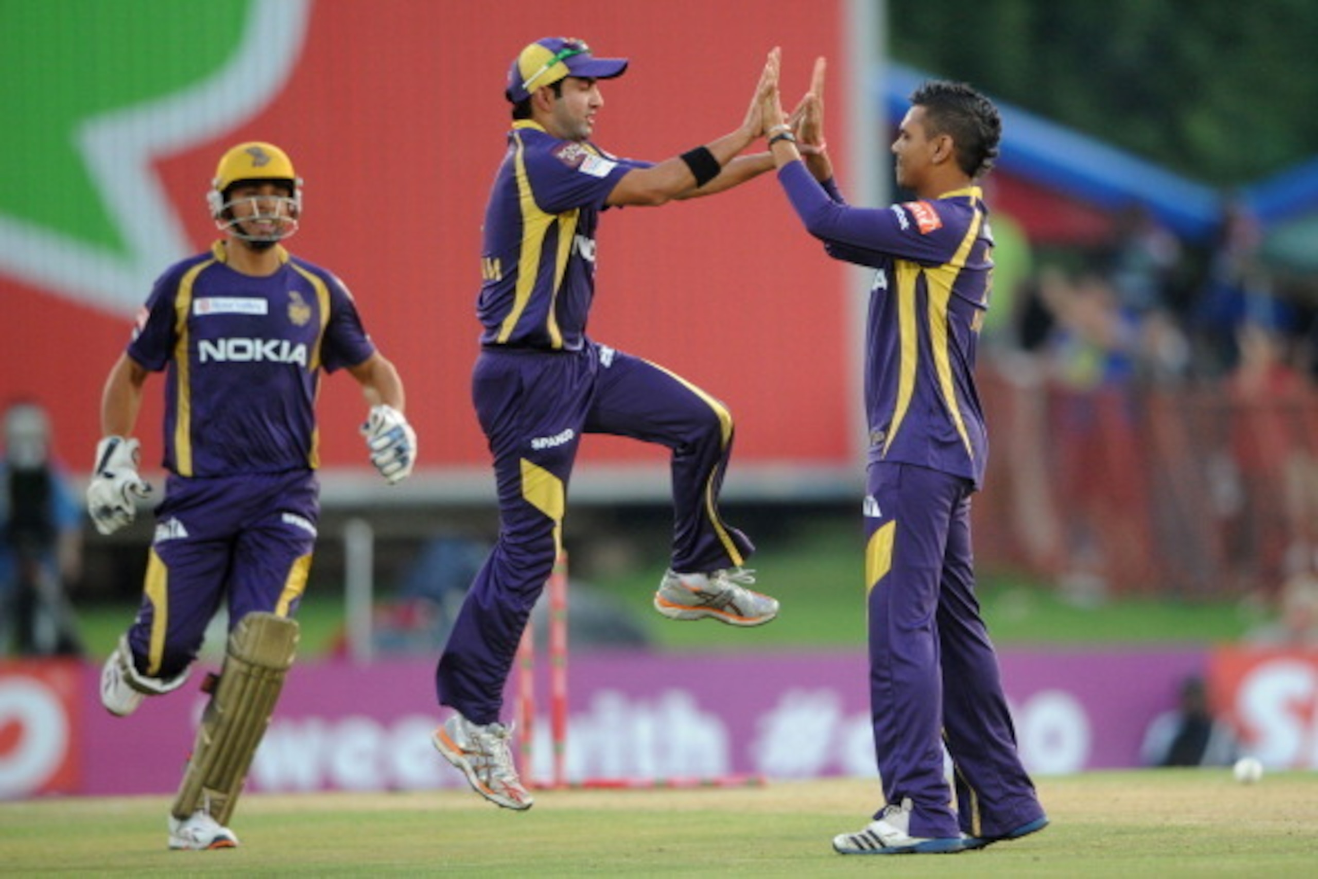 PRETORIA, SOUTH AFRCA - OCTOBER 13:  Sunil Narine (R) of the Knight Riders celebrates with Gautam Gambhir after capturing the wicket of Mahela Jayawardene (not pictured) of the Daredevils during the Karbonn Smart CLT20 Group A match between Kolkata Knight