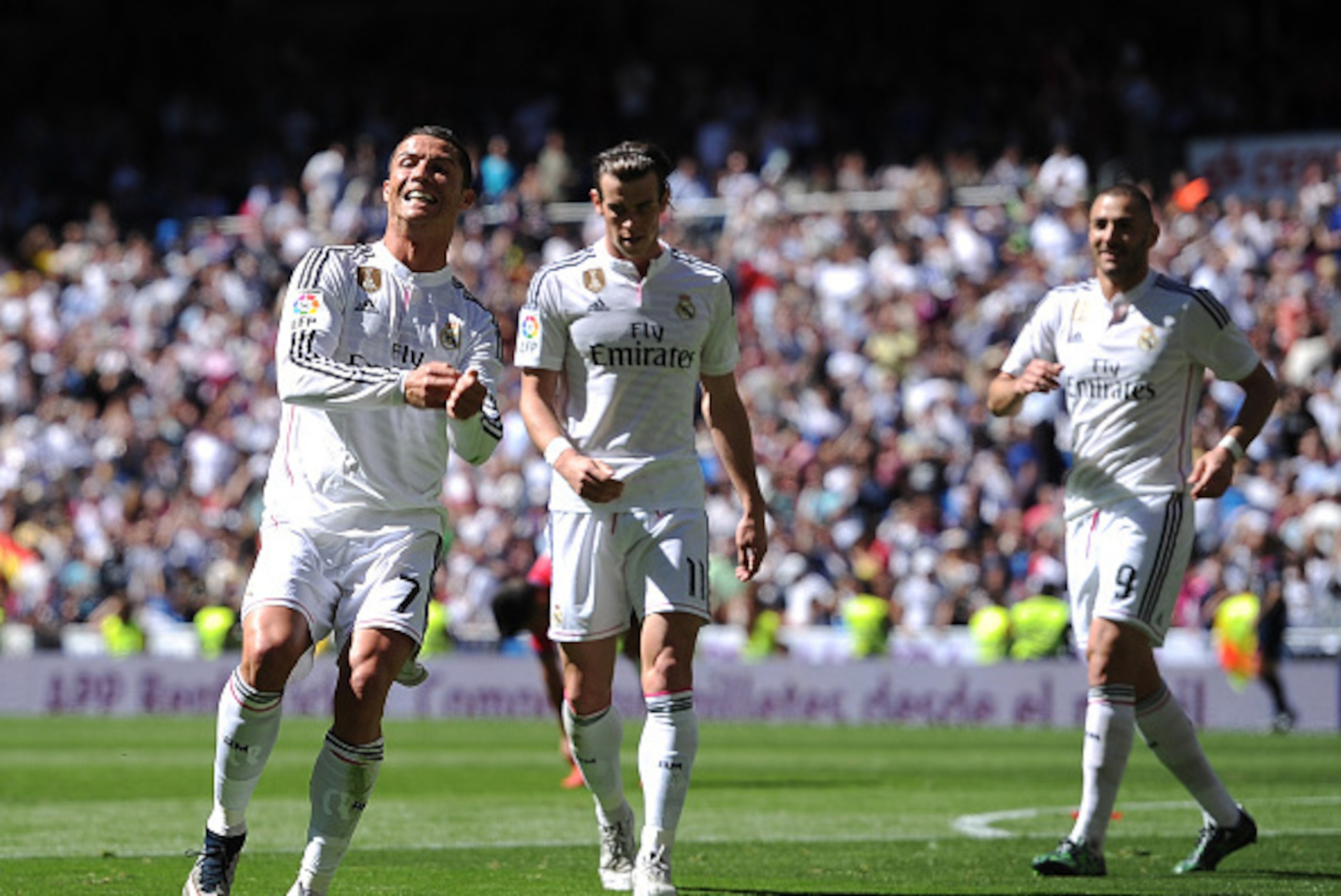 MADRID, SPAIN - APRIL 05:  Cristiano Ronaldo of Real Madrid CF celebrates after scoring his team's 4th goal during the La Liga match between Real Madrid CF and Granada CF at Estadio Santiago Bernabeu on April 5, 2015 in Madrid, Spain.  (Photo by Denis Doy