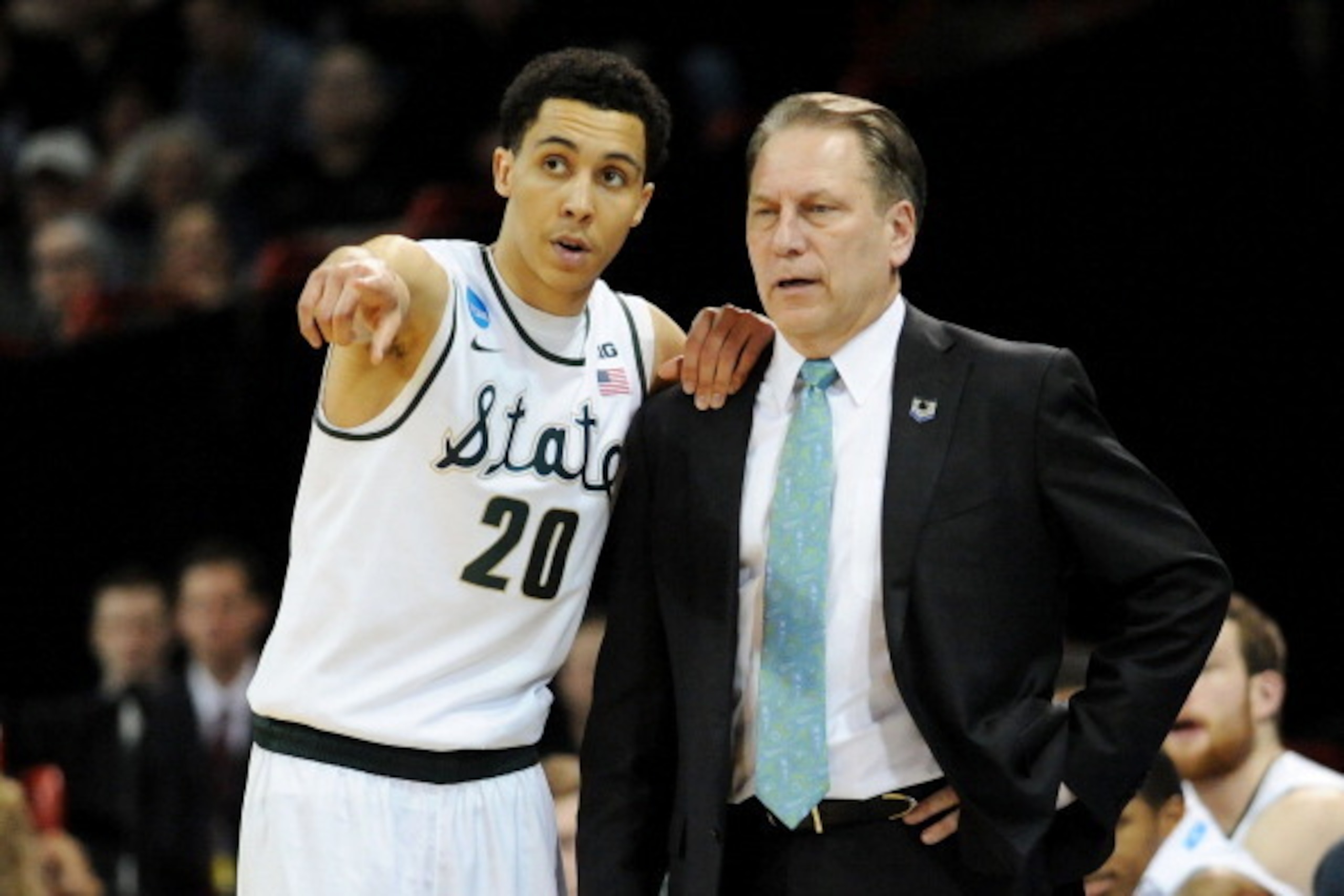 SPOKANE, WA - MARCH 22:  Head coach Tom Izzo and Travis Trice #20 of the Michigan State Spartans talk in the second half against the Harvard Crimson during the Third Round of the 2014 NCAA Basketball Tournament at Spokane Veterans Memorial Arena on March 