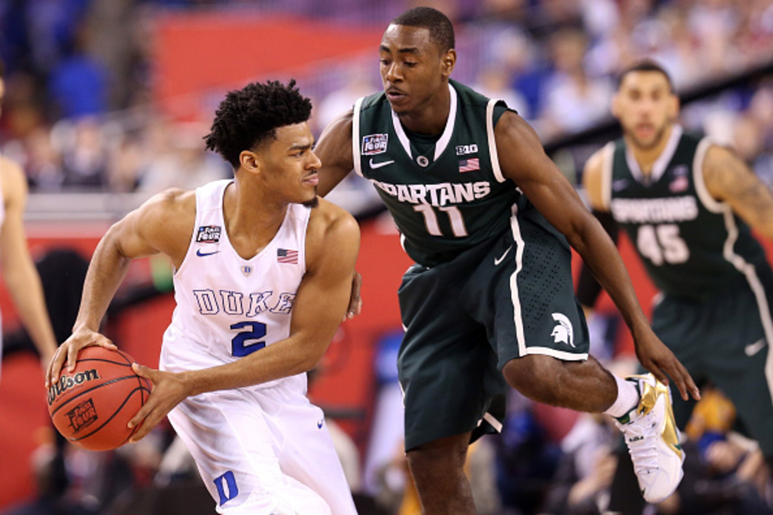INDIANAPOLIS, IN - APRIL 04:  Quinn Cook #2 of the Duke Blue Devils handles the ball against Lourawls Nairn Jr. in the second half during the NCAA Men's Final Four Semifinal at Lucas Oil Stadium on April 4, 2015 in Indianapolis, Indiana.  (Photo by Street