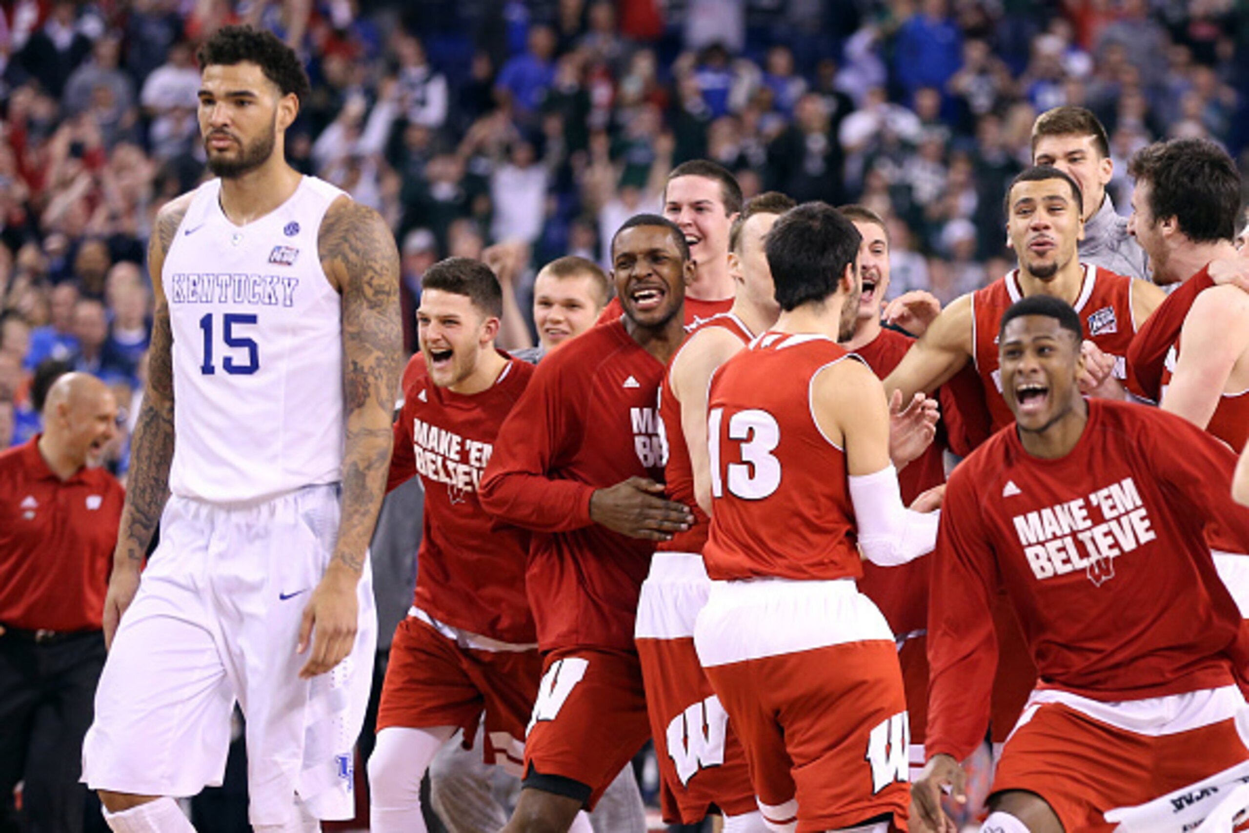INDIANAPOLIS, IN - APRIL 04: The Wisconsin Badgers celebrate after defeating the Kentucky Wildcats as Willie Cauley-Stein #15 looks on during the NCAA Men's Final Four Semifinal at Lucas Oil Stadium on April 4, 2015 in Indianapolis, Indiana.  Wisconsin de