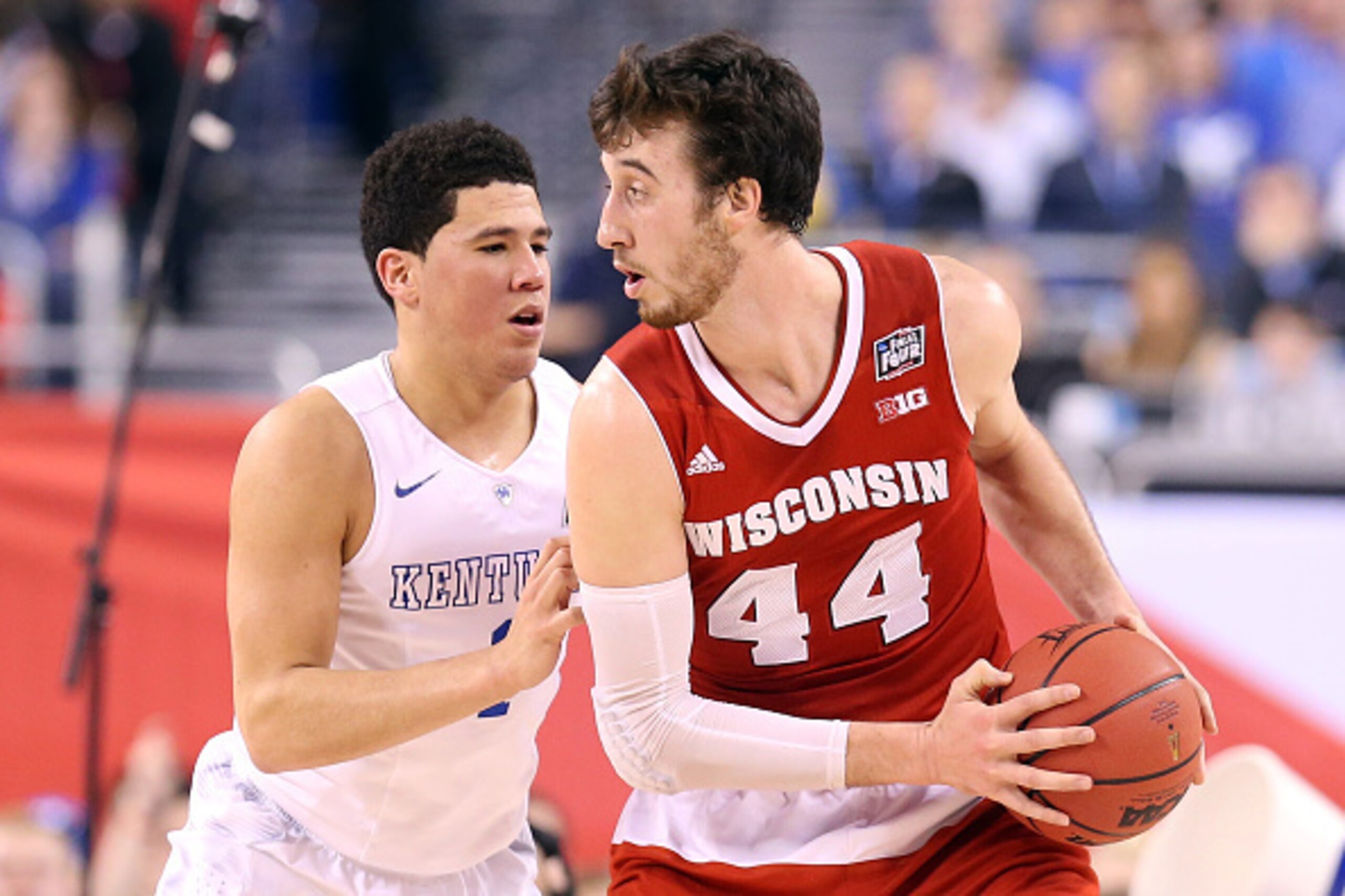INDIANAPOLIS, IN - APRIL 04: Frank Kaminsky #44 of the Wisconsin Badgers handles the ball against Devin Booker in the first half during the NCAA Men's Final Four Semifinal at Lucas Oil Stadium on April 4, 2015 in Indianapolis, Indiana.  (Photo by Streeter