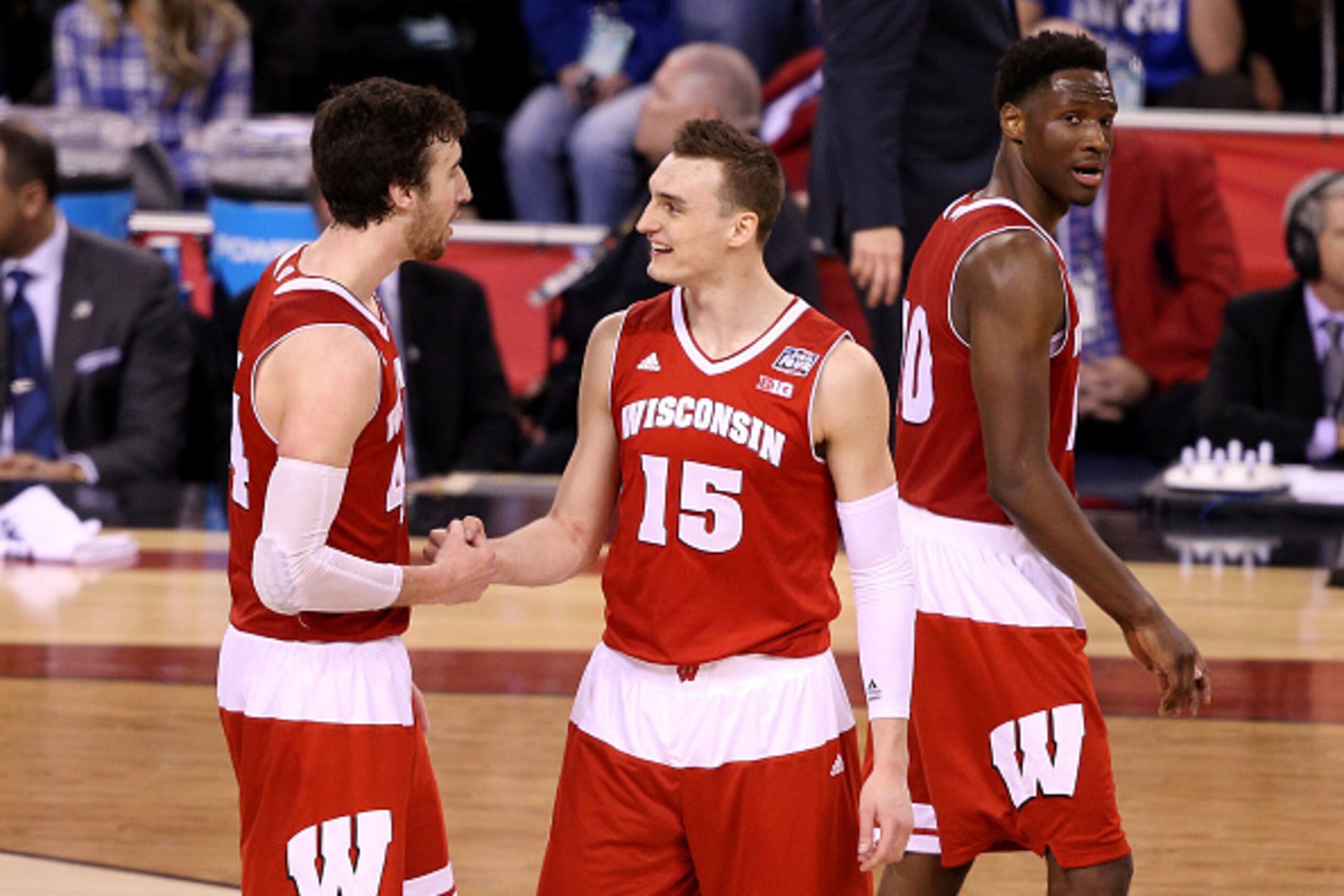 INDIANAPOLIS, IN - APRIL 04: Frank Kaminsky #44 and Sam Dekker #15 of the Wisconsin Badgers react late in the game against the Kentucky Wildcats during the NCAA Men's Final Four Semifinal at Lucas Oil Stadium on April 4, 2015 in Indianapolis, Indiana.  (P