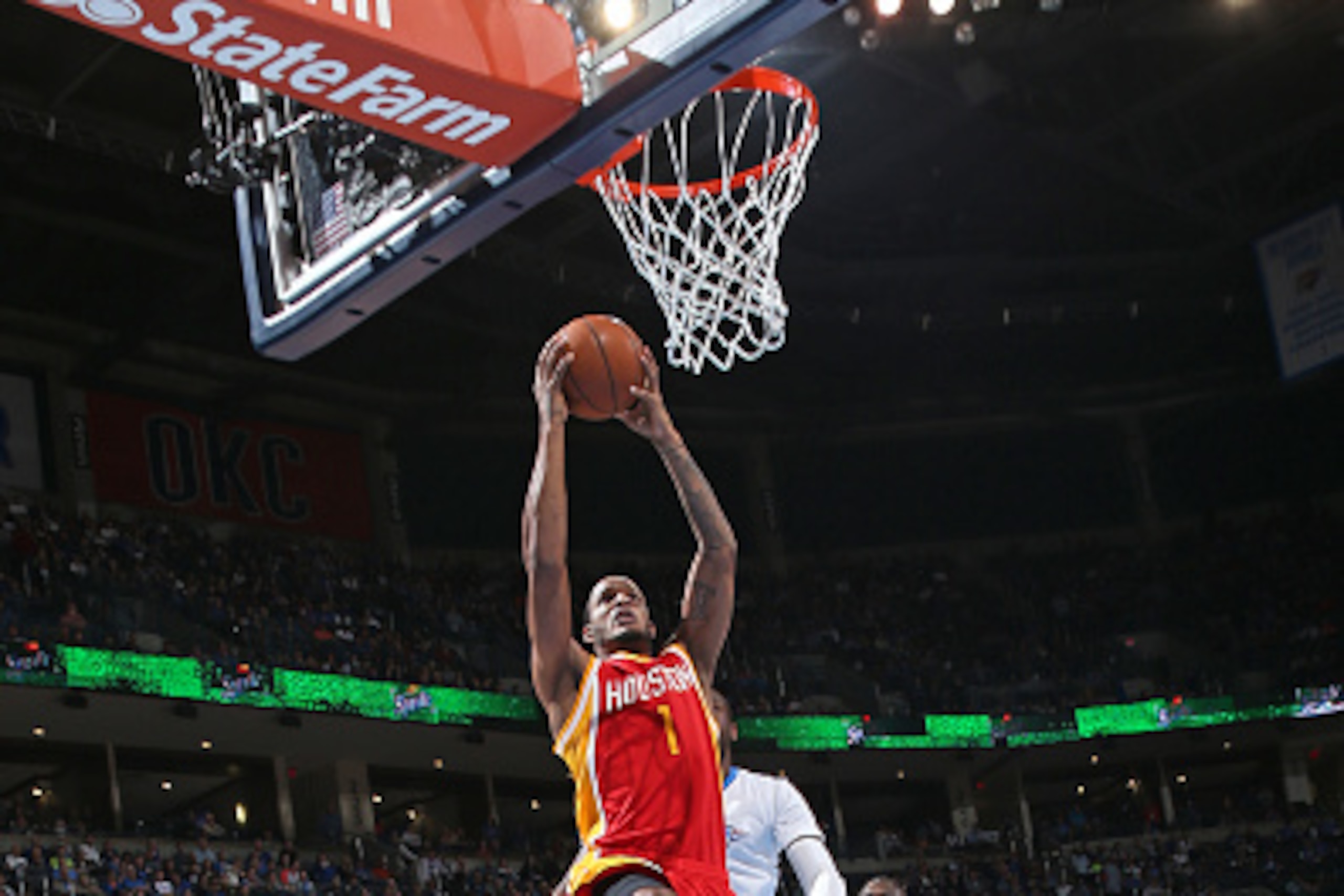 OKLAHOMA CITY, OK - APRIL 5:  Trevor Ariza #1 of the Houston Rockets goes up for a dunk against the Oklahoma City Thunder on April 5, 2015 at the Chesapeake Energy Arena in Oklahoma City, Oklahoma. NOTE TO USER: User expressly acknowledges and agrees that