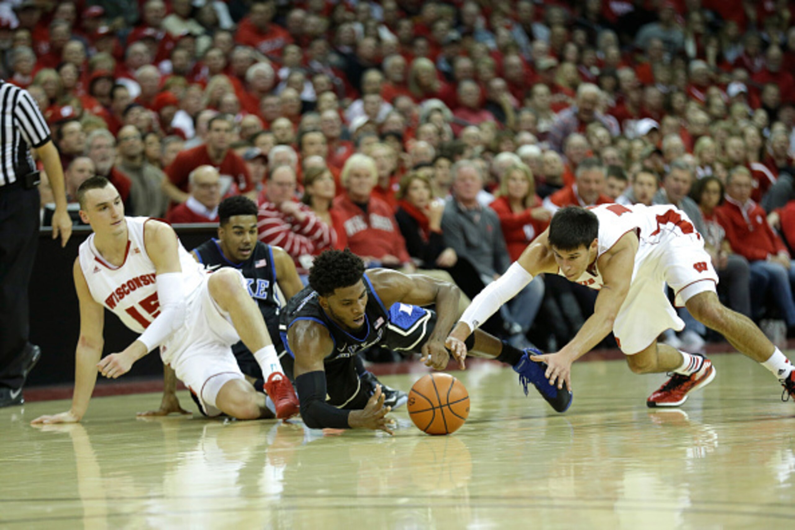 MADISON, WI - DECEMBER 03: Justise Winslow #12 of the Duke Blue Devils fights Duje Dukan #13 of the Wisconsin Badgers for a loose ball during the first half at Kohl Center on December 03, 2014 in Madison, Wisconsin. (Photo by Mike McGinnis/Getty Images)