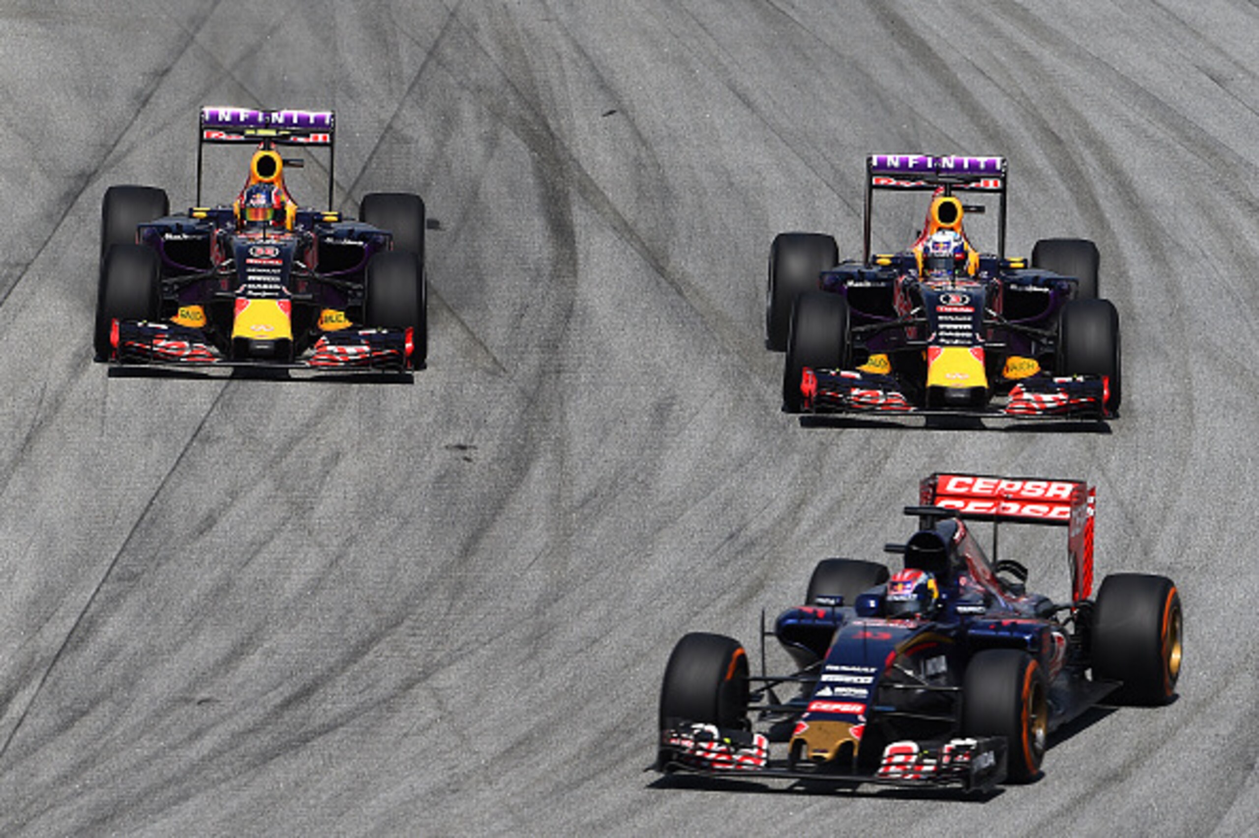 KUALA LUMPUR, MALAYSIA - MARCH 29: Daniel Ricciardo of Australia and Infiniti Red Bull Racing and Daniil Kvyat of Russia and Infiniti Red Bull Racing drive next to Max Verstappen of Netherlands and Scuderia Toro Rosso during the Malaysia Formula One Gran KUALA LUMPUR, MALAYSIA - MARCH 29: Daniel Ricciardo of Australia and Infiniti Red Bull Racing and Daniil Kvyat of Russia and Infiniti Red Bull Racing drive next to Max Verstappen of Netherlands and Scuderia Toro Rosso during the Malaysia Formula One Gran