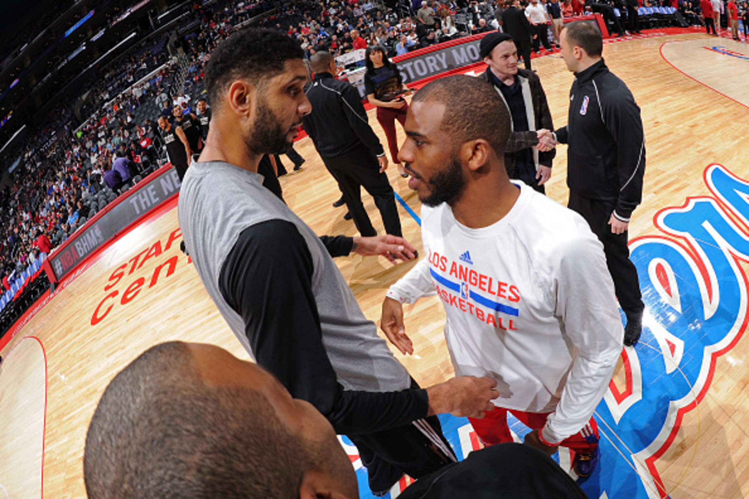 LOS ANGELES, CA - FEBRUARY 19:   Tim Duncan #21 of the San Antonio Spurs and Chris Paul #3 of the Los Angeles Clippers greet each other before the game on February 19, 2015 at Staples Center in Los Angeles, California. NOTE TO USER: User expressly acknowl