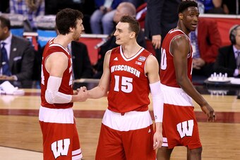INDIANAPOLIS, IN - APRIL 04: Frank Kaminsky #44 and Sam Dekker #15 of the Wisconsin Badgers react late in the game against the Kentucky Wildcats during the NCAA Men's Final Four Semifinal at Lucas Oil Stadium on April 4, 2015 in Indianapolis, Indiana.  (P