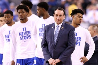 INDIANAPOLIS, IN - APRIL 04:  Head coach Mike Krzyzewski of the Duke Blue Devils stands with his team before taking on the Michigan State Spartans during the NCAA Men's Final Four Semifinal at Lucas Oil Stadium on April 4, 2015 in Indianapolis, Indiana.  