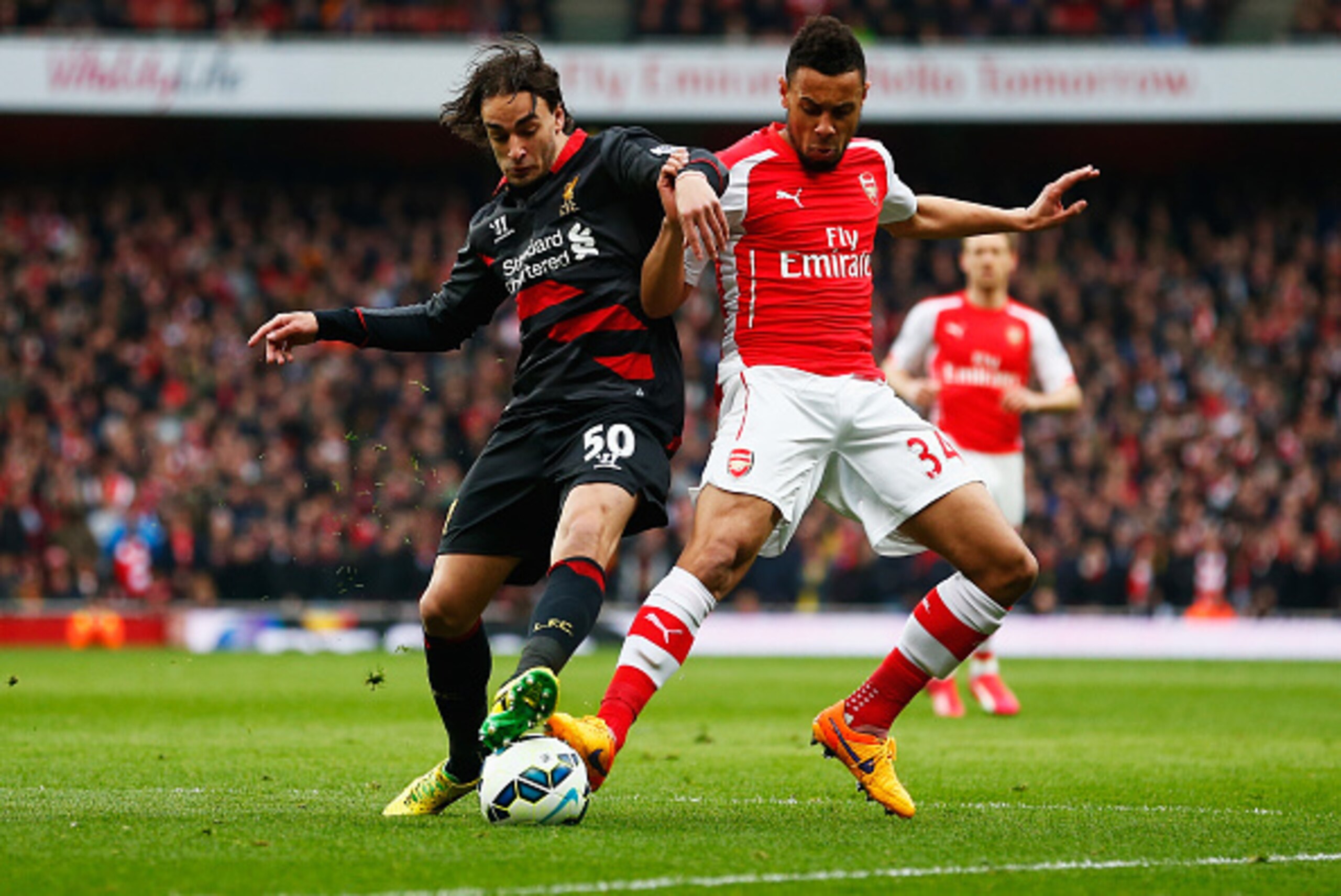 LONDON, ENGLAND - APRIL 04:  Francis Coquelin of Arsenal battles for the ball with Lazar Markovic of Liverpool during the Barclays Premier League match between Arsenal and Liverpool at Emirates Stadium on April 4, 2015 in London, England.  (Photo by Julia