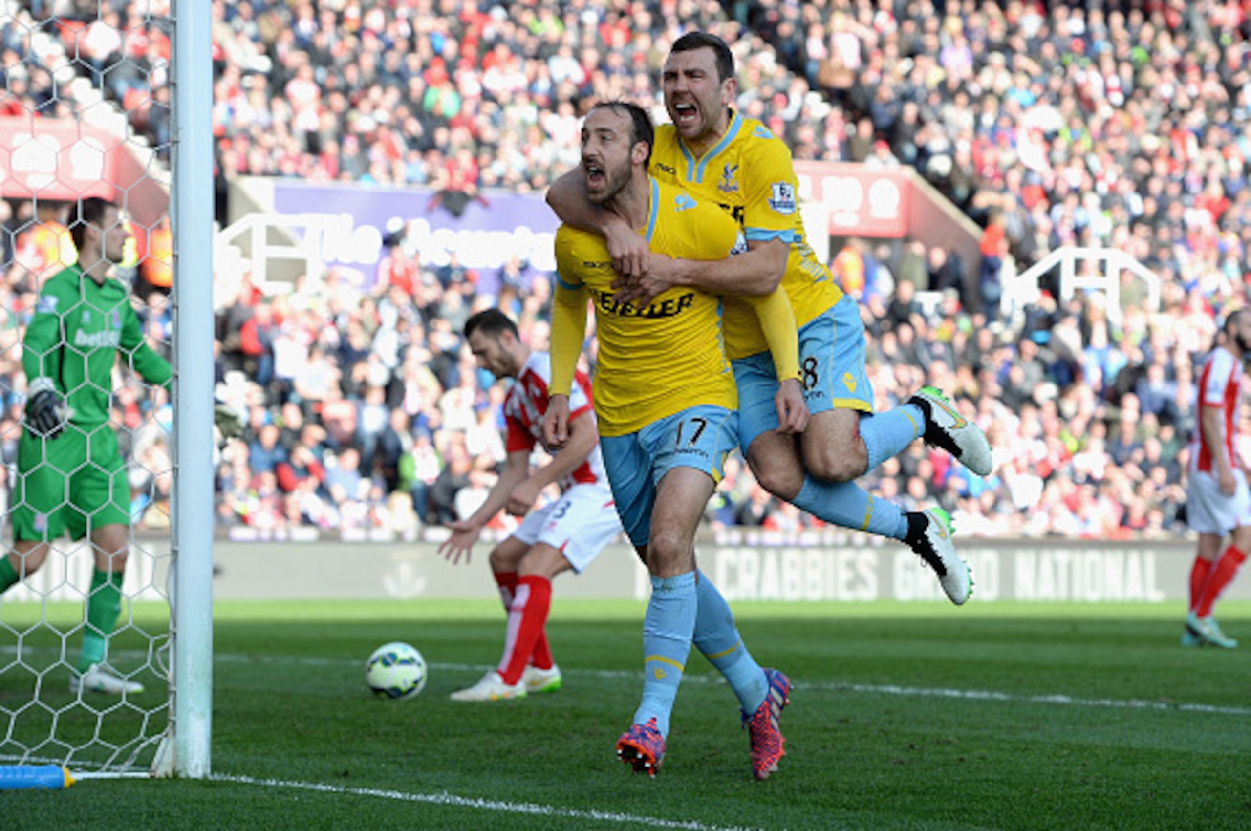 STOKE ON TRENT, ENGLAND - MARCH 21: Glenn Murray of Crystal Palace (L) celebrates scoring their first goal from the penalty spot with James McArthur of Crystal Palace during the Barclays Premier League match between Stoke City and Crystal Palace at Brita STOKE ON TRENT, ENGLAND - MARCH 21: Glenn Murray of Crystal Palace (L) celebrates scoring their first goal from the penalty spot with James McArthur of Crystal Palace during the Barclays Premier League match between Stoke City and Crystal Palace at Brita