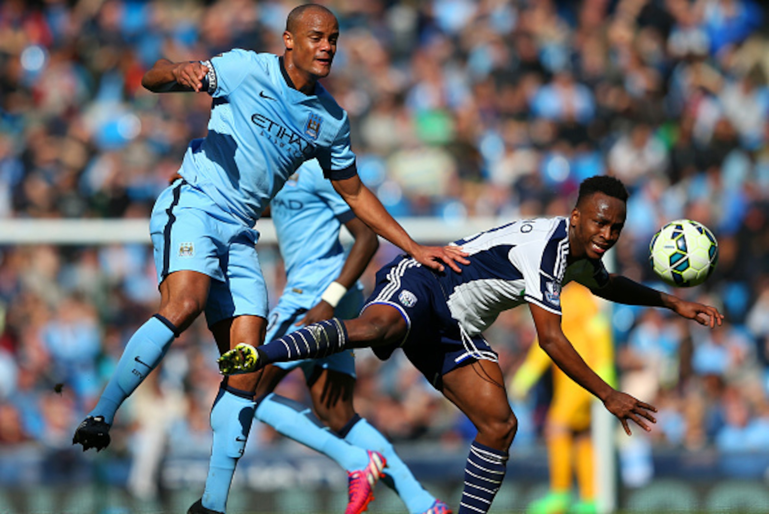 MANCHESTER, ENGLAND - MARCH 21: Vincent Kompany of Manchester City and Saido Berahino of West Brom batlte for the ball during the Barclays Premier League match between Manchester City and West Bromwich Albion at Etihad Stadium on March 21, 2015 in Manche MANCHESTER, ENGLAND - MARCH 21: Vincent Kompany of Manchester City and Saido Berahino of West Brom batlte for the ball during the Barclays Premier League match between Manchester City and West Bromwich Albion at Etihad Stadium on March 21, 2015 in Manche