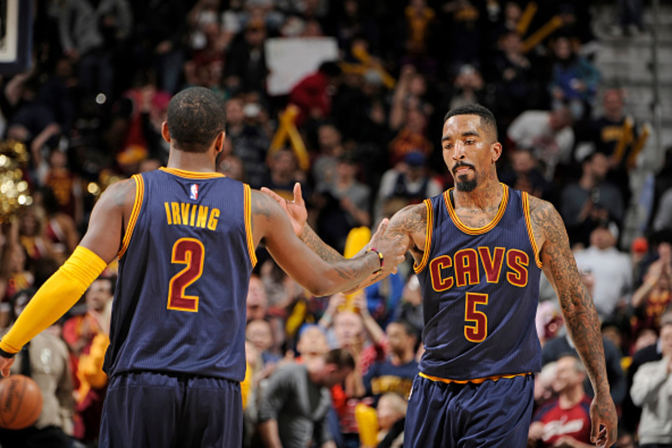 CLEVELAND, OH - APRIL 5:  J.R. Smith #5 and Kyrie Irving #2 of the Cleveland Cavaliers celebrate during the game against the Chicago Bulls on April 5, 2015 at Quicken Loans Arena in Cleveland, Ohio. NOTE TO USER: User expressly acknowledges and agrees tha