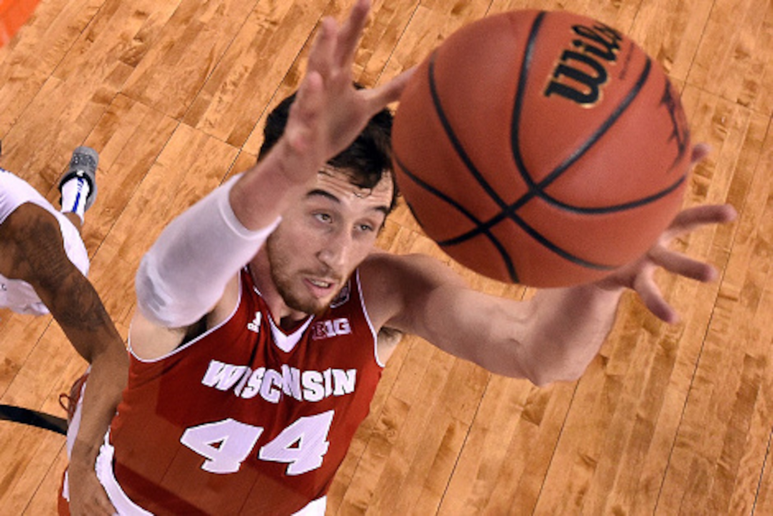 INDIANAPOLIS, IN - APRIL 04: Frank Kaminsky #44 of the Wisconsin Badgers goes up for the ball against Tyler Ulis #3 of the Kentucky Wildcats in the second half during the NCAA Men's Final Four Semifinal at Lucas Oil Stadium on April 4, 2015 in Indianapoli