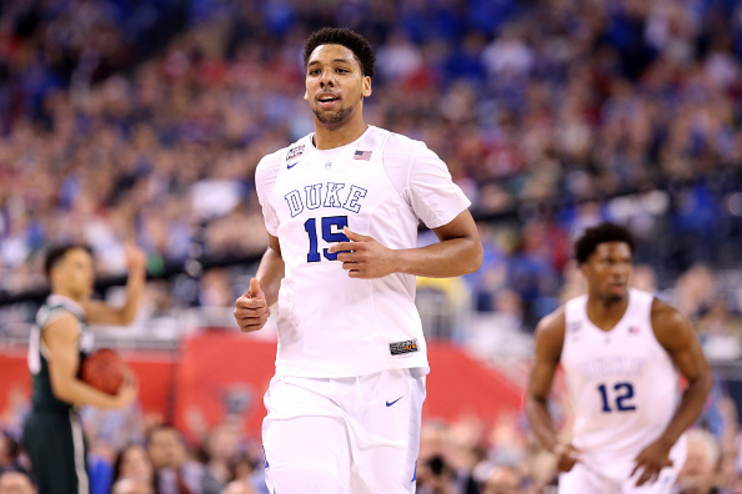 INDIANAPOLIS, IN - APRIL 04: Jahlil Okafor #15 of the Duke Blue Devils reacts after a play in the second half against the Michigan State Spartans during the NCAA Men's Final Four Semifinal at Lucas Oil Stadium on April 4, 2015 in Indianapolis, Indiana.  (