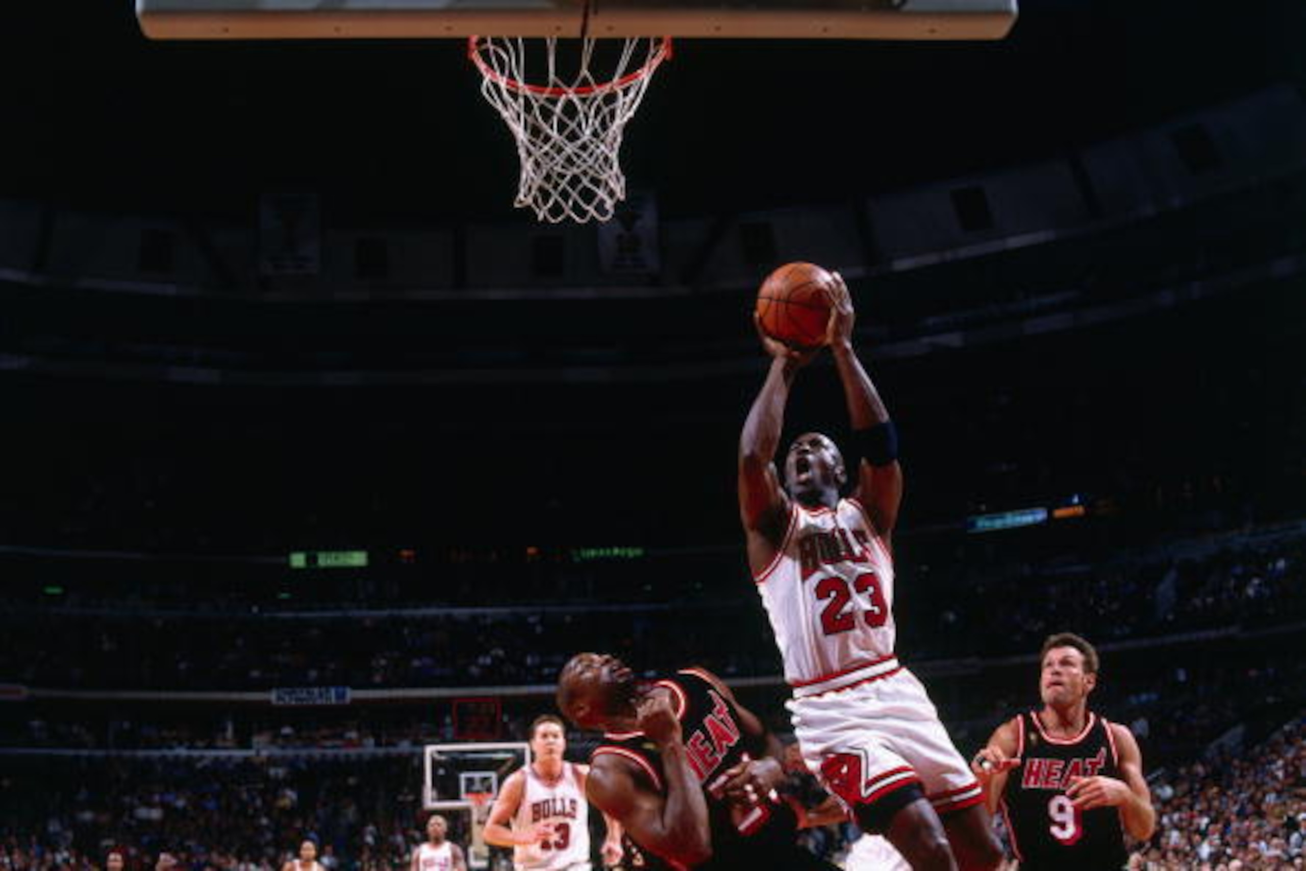 CHICAGO - MAY 22:  Michael Jordan #23 of the Chicago Bulls goes up for a shot against Voshon Lenard #21 of the Miami Heat in Game Two of the Eastern Conference Finals during the 1997 NBA Playoffs at the United Center on May 22, 1997 in Chicago, Illinois. 