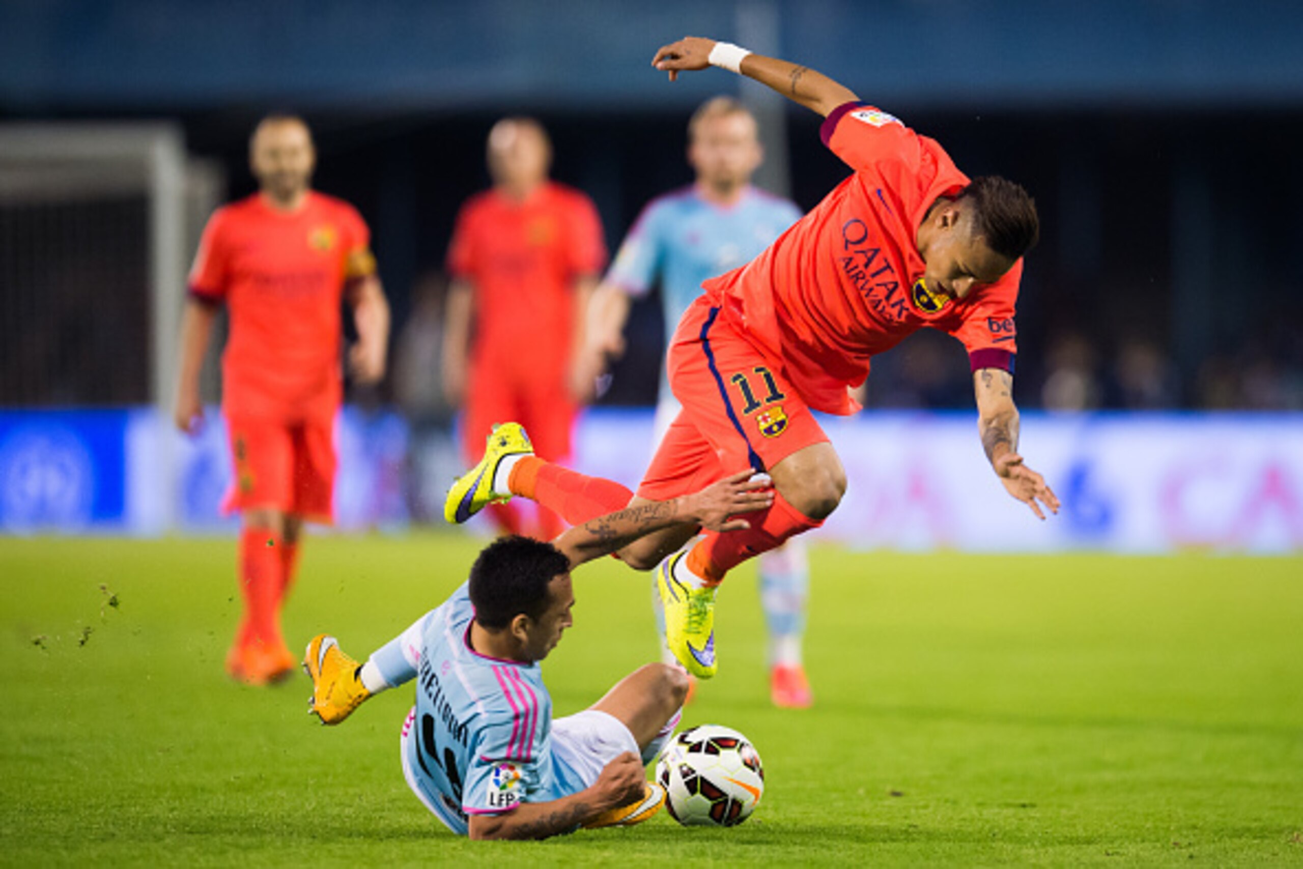 VIGO, SPAIN - APRIL 05: Neymar Santos Jr of FC Barcelona is brought down by Fabian Orellana of Celta Vigo during the La Liga match between Celta Vigo and FC Barcelona at Estadio Balaidos on April 5, 2015 in Vigo, Spain. (Photo by Alex Caparros/Getty Image VIGO, SPAIN - APRIL 05: Neymar Santos Jr of FC Barcelona is brought down by Fabian Orellana of Celta Vigo during the La Liga match between Celta Vigo and FC Barcelona at Estadio Balaidos on April 5, 2015 in Vigo, Spain. (Photo by Alex Caparros/Getty Image