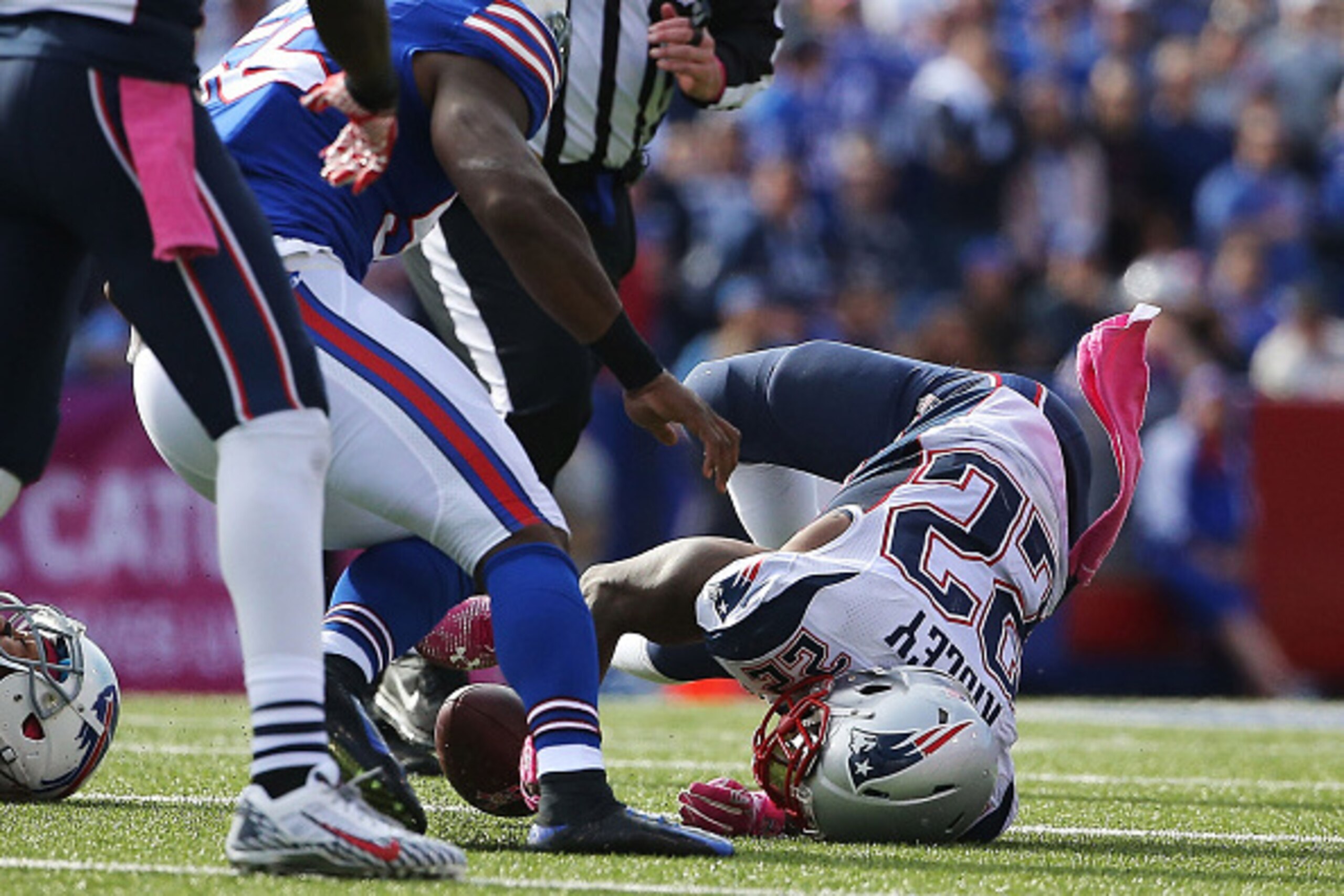 ORCHARD PARK, NY - OCTOBER 12:   Stevan Ridley #22 of the New England Patriots falls hard to the turf against the Buffalo Bills  during the second half at Ralph Wilson Stadium on October 12, 2014 in Orchard Park, New York.  (Photo by Tom Szczerbowski/Gett