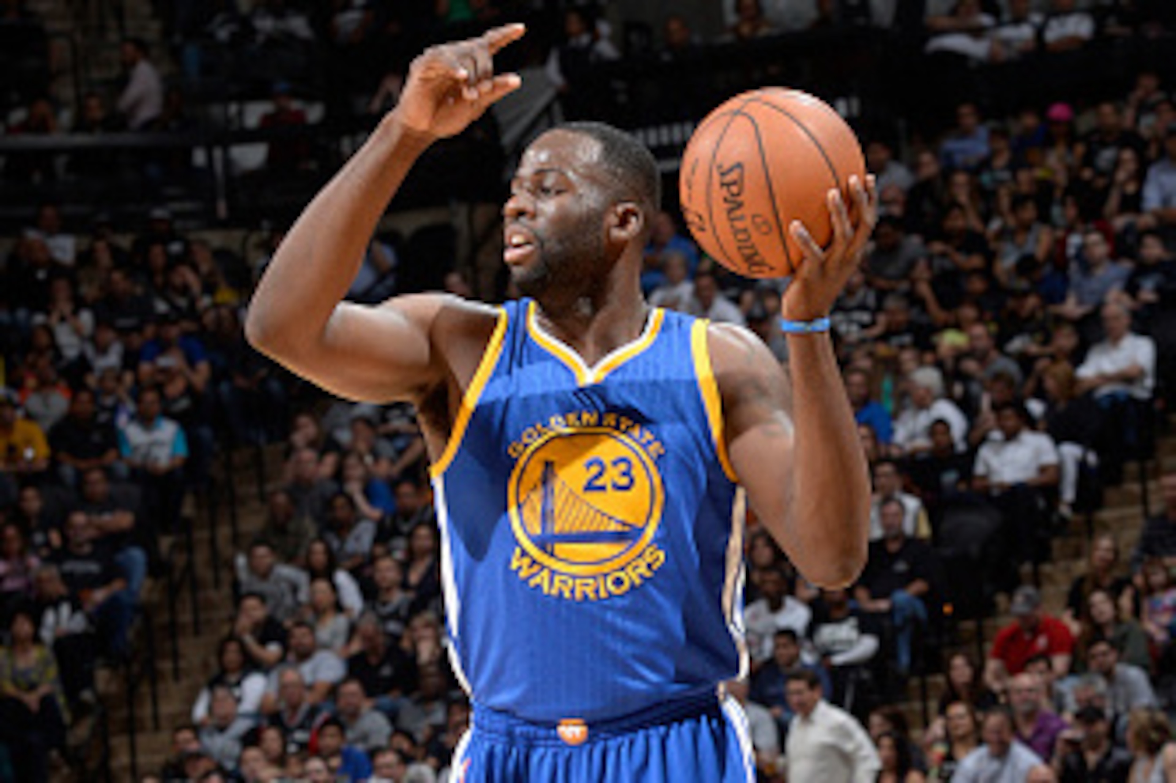SAN ANTONIO, TX - APRIL 5: Draymond Green #23 of the Golden State Warriors handles the ball against the San Antonio Spurs on April 5, 2015 at the AT&T Center in San Antonio, Texas. NOTE TO USER: User expressly acknowledges and agrees that, by downloading 