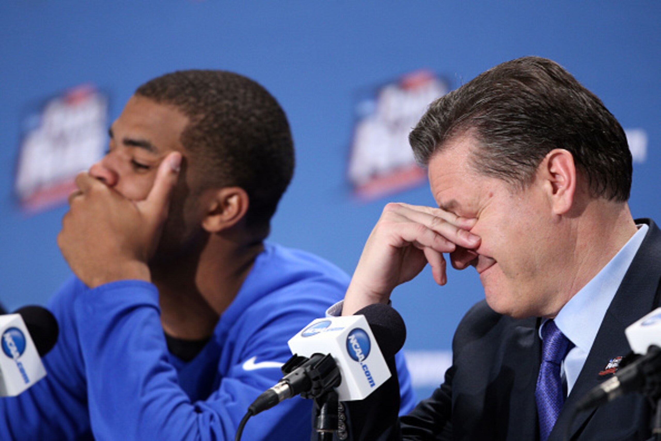 INDIANAPOLIS, IN - APRIL 04: Head coach John Calipari of the Kentucky Wildcats reacts in the post game press conference after being defeated by the Wisconsin Badgers during the NCAA Men's Final Four Semifinal at Lucas Oil Stadium on April 4, 2015 in Indi INDIANAPOLIS, IN - APRIL 04: Head coach John Calipari of the Kentucky Wildcats reacts in the post game press conference after being defeated by the Wisconsin Badgers during the NCAA Men's Final Four Semifinal at Lucas Oil Stadium on April 4, 2015 in Indi