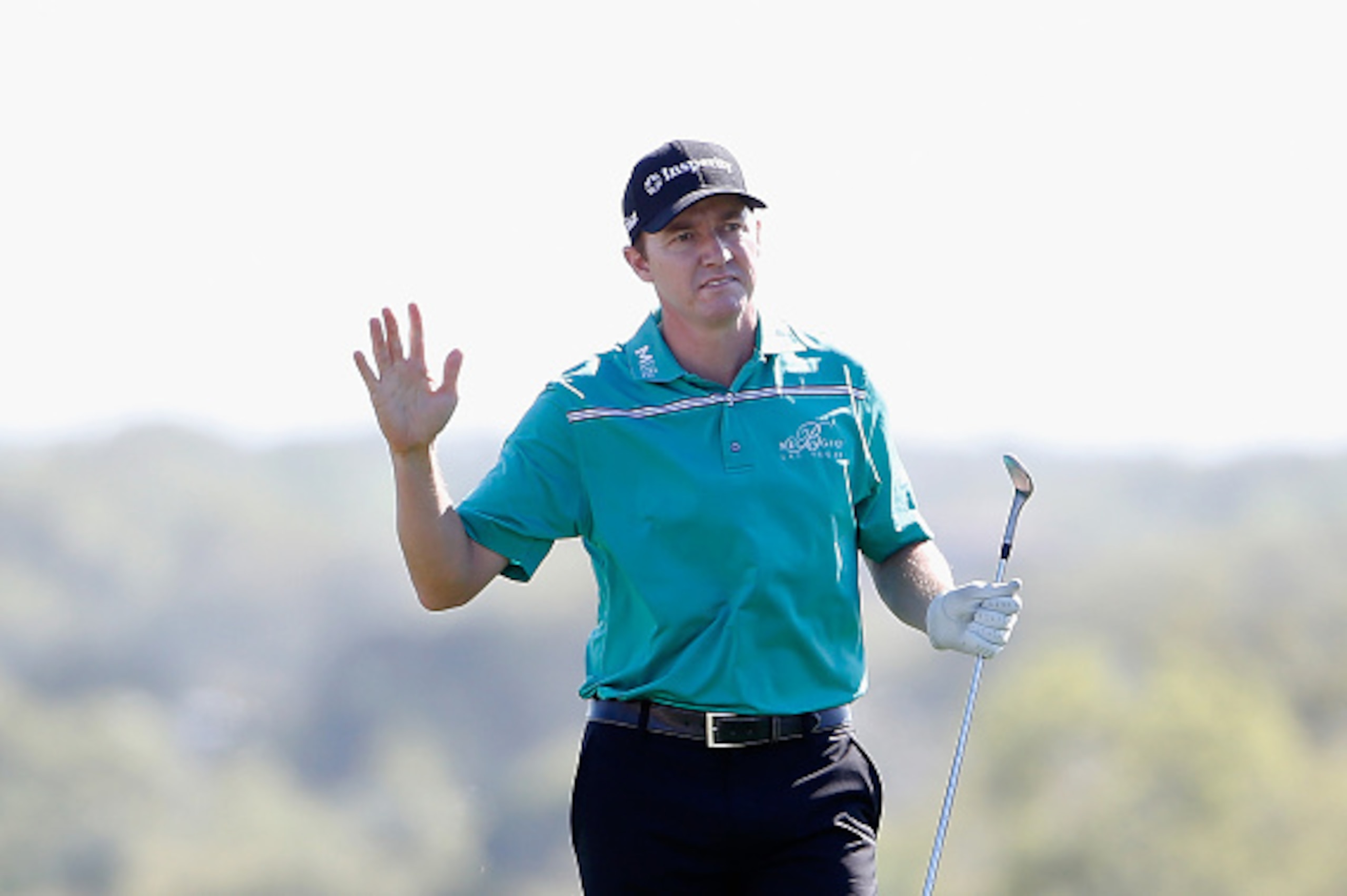 SAN ANTONIO, TX - MARCH 29: Jimmy Walker waves to the crowd as he walks up the 18th hole during the final round of the Valero Texas Open at TPC San Antonio AT&T Oaks Course on March 29, 2015 in San Antonio, Texas.  (Photo by Christian Petersen/Getty Image