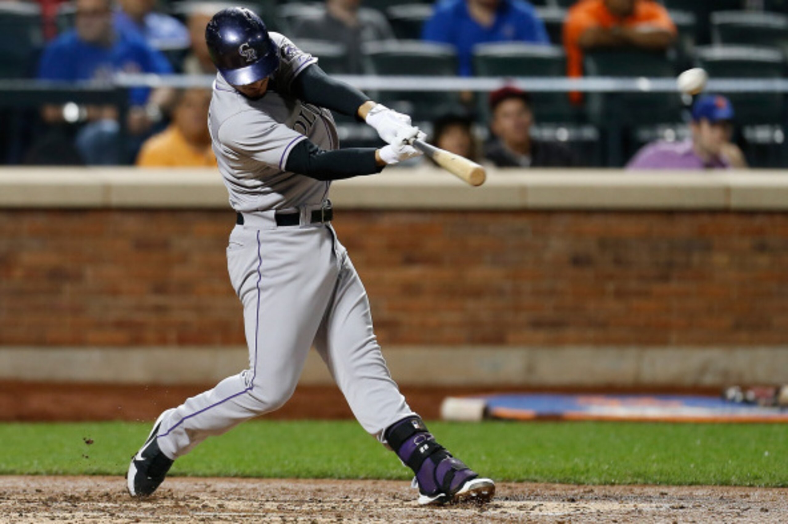 NEW YORK, NY - SEPTEMBER 09:  Nolan Arenado #28 of the Colorado Rockies doubles in the fourth inning against the New York Mets at Citi Field on September 9, 2014 in the Flushing neighborhood of the Queens borough of New York City.  (Photo by Mike Stobe/Ge