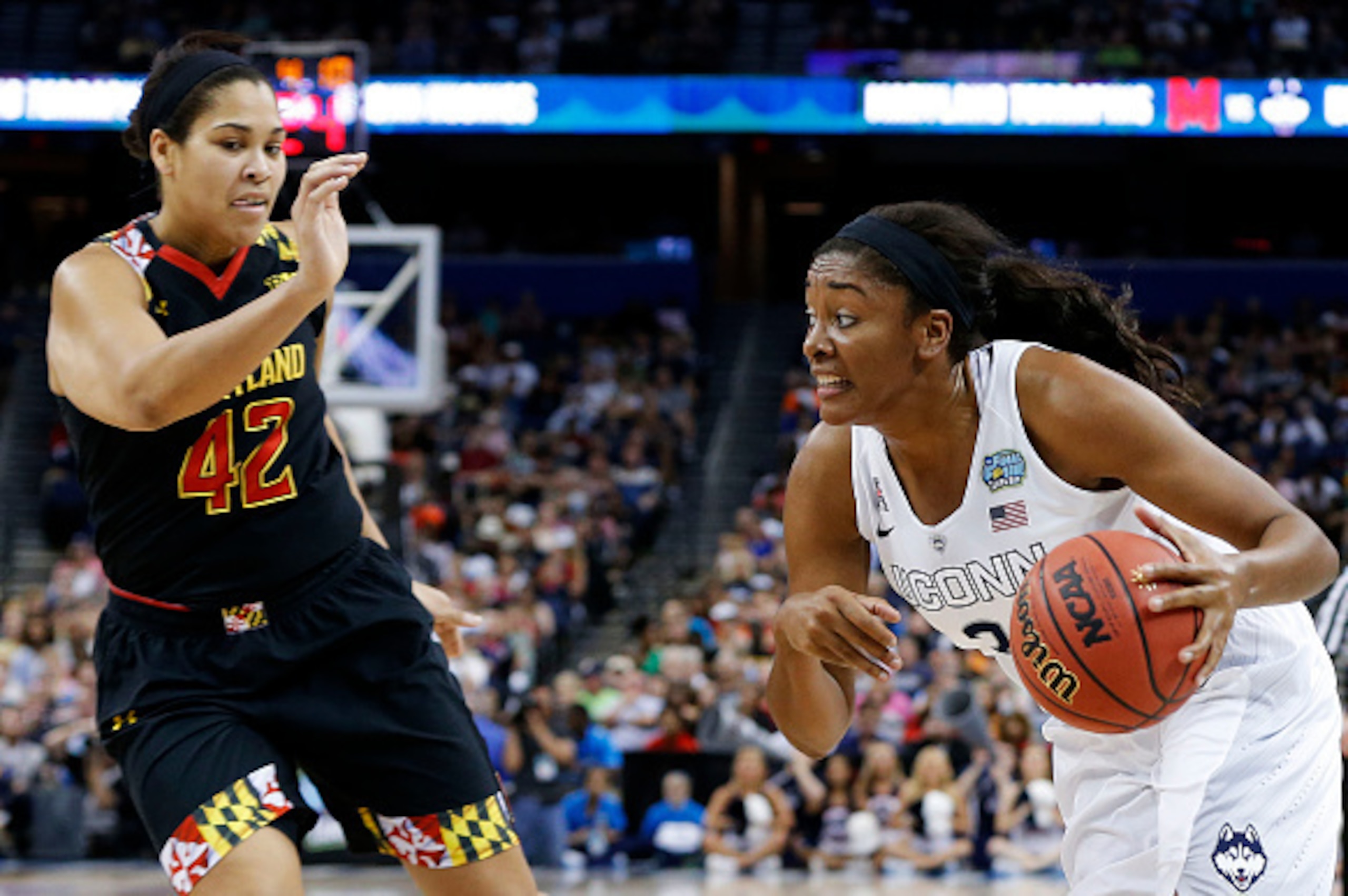 TAMPA, FL - APRIL 05:  Morgan Tuck #3 of the Connecticut Huskies drives against Brionna Jones #42 of the Maryland Terrapins in the first half during the NCAA Women's Final Four Semifinal at Amalie Arena on April 5, 2015 in Tampa, Florida.  (Photo by Mike 